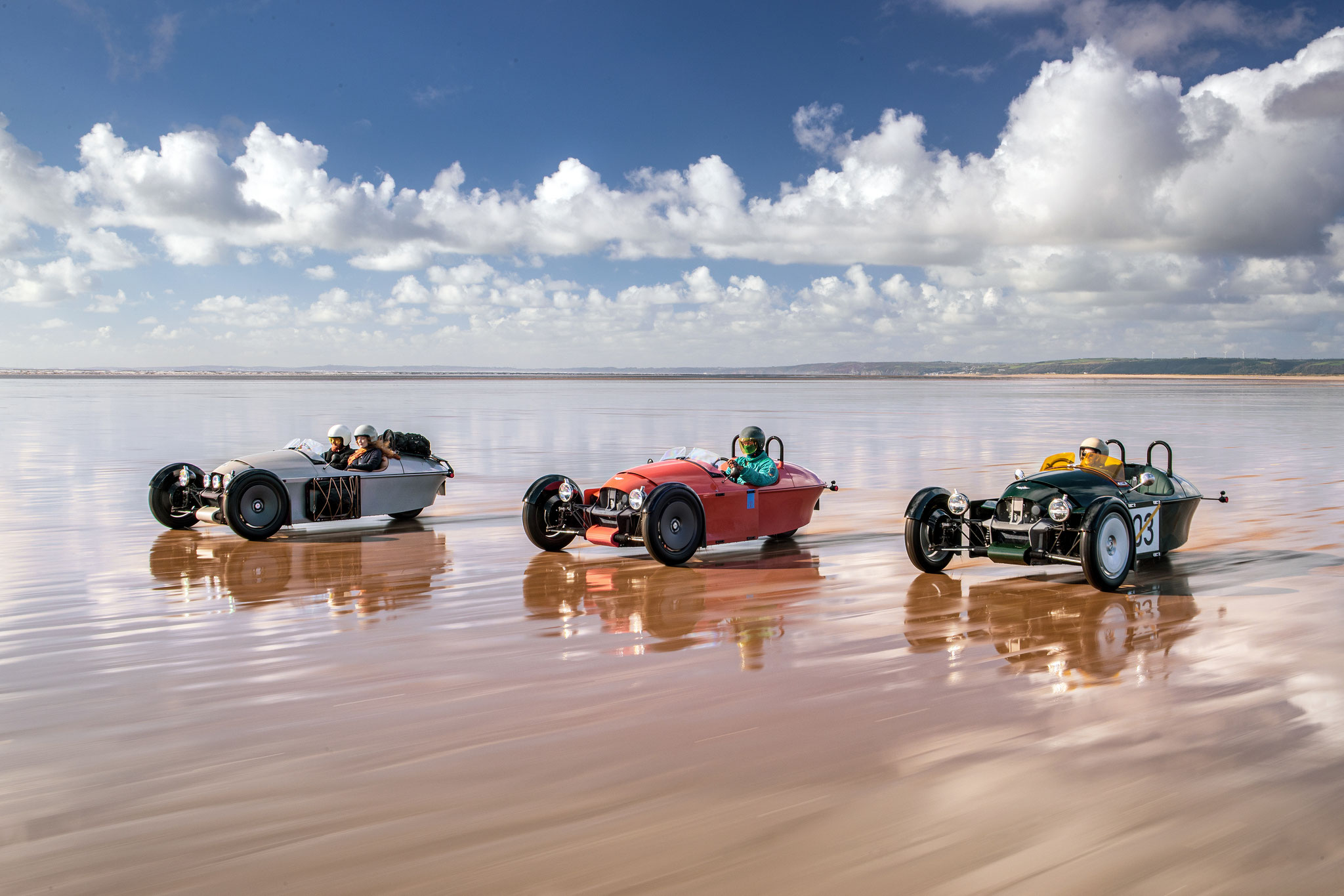Super 3 in Reihe am Strand Fahrend