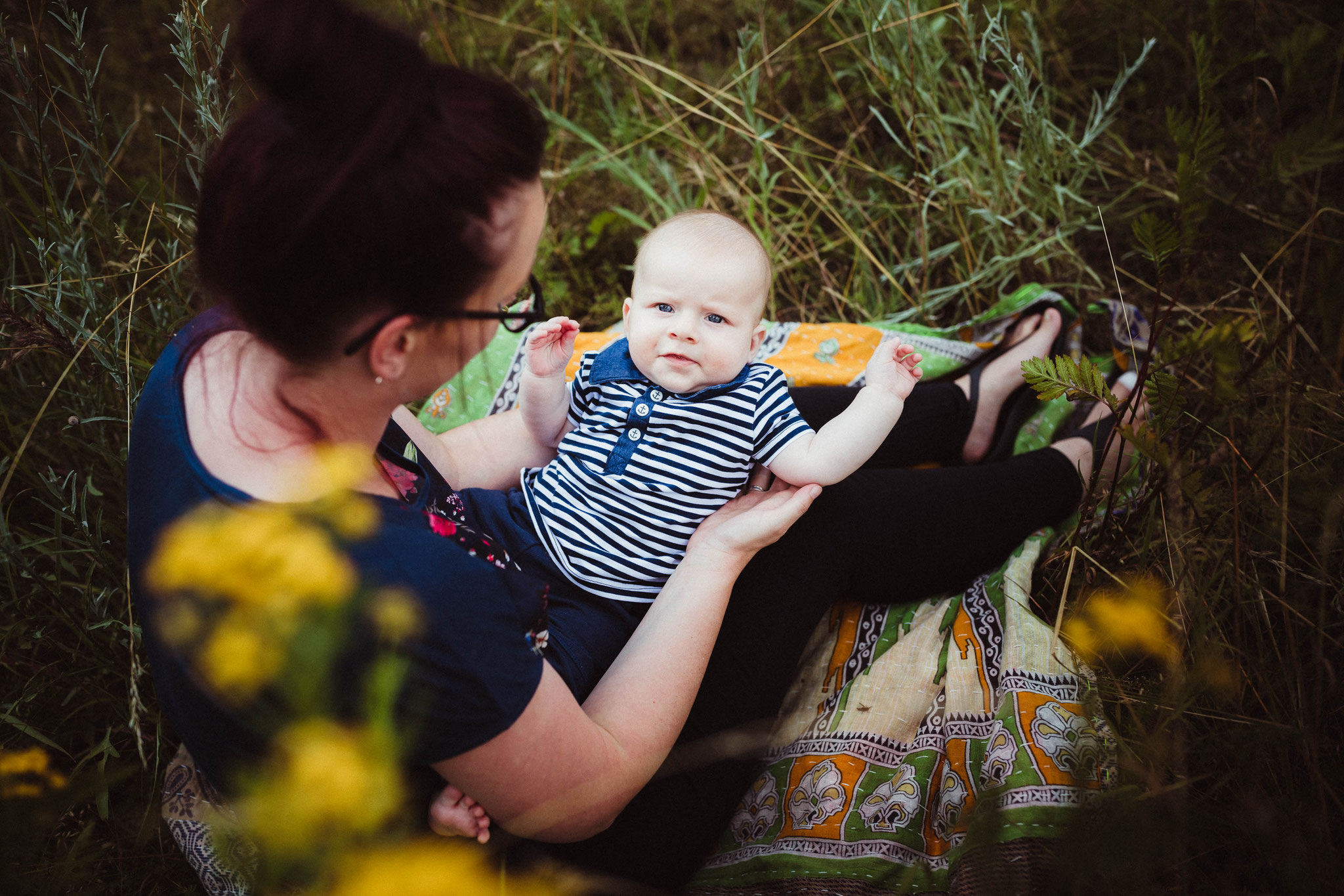 Baby auf Mamas Arm