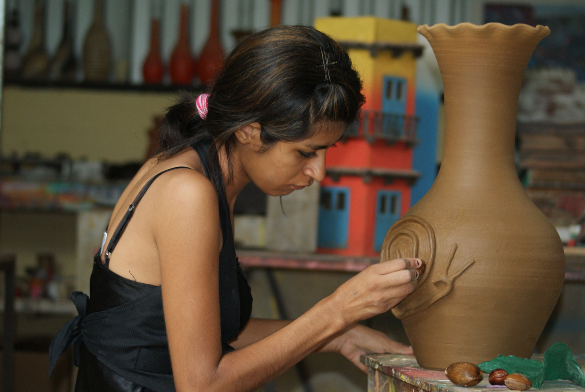 A young woman creates ceramics for her new business