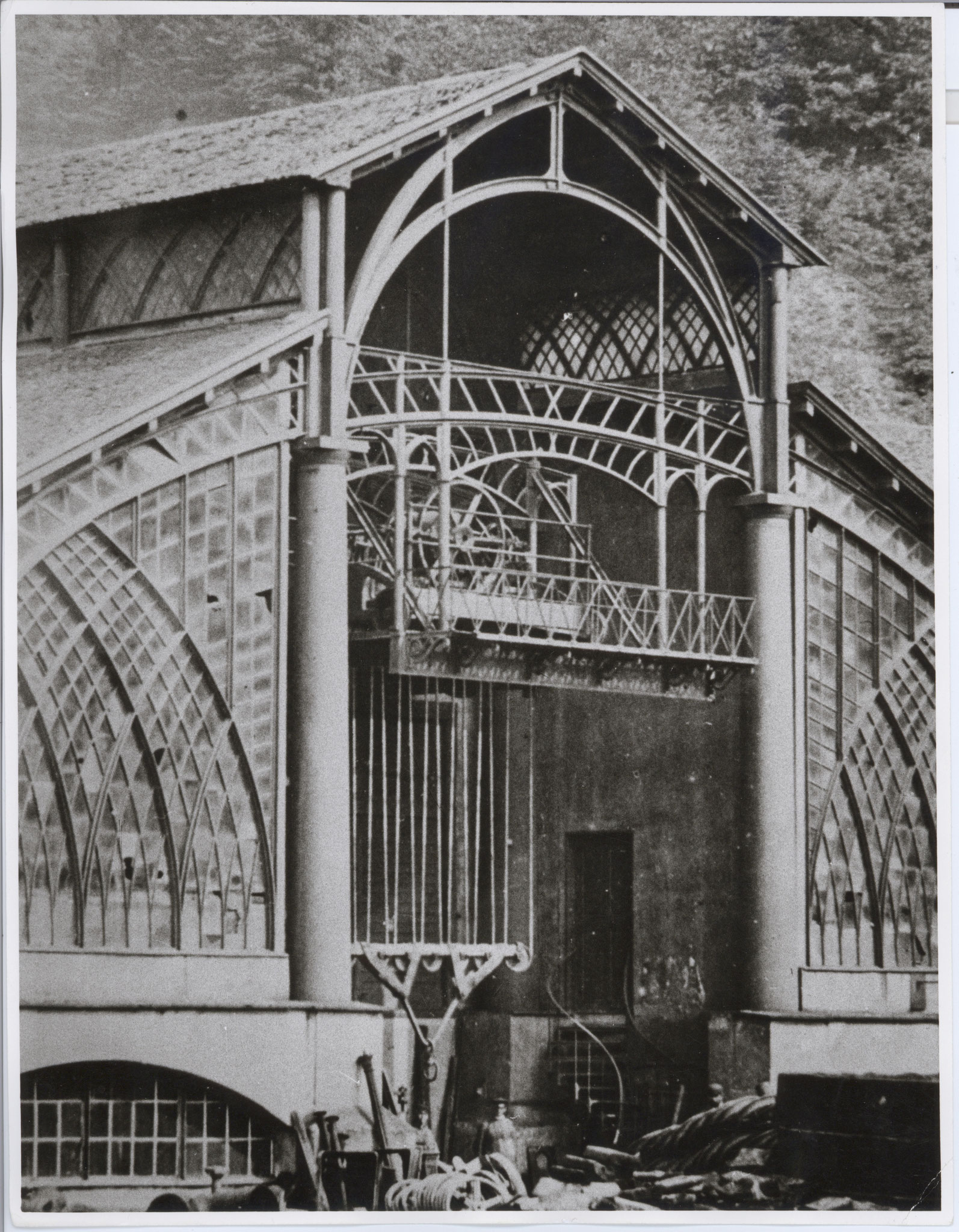 Part of the west façade with the crane runway, its hoist lowered; around 1869.