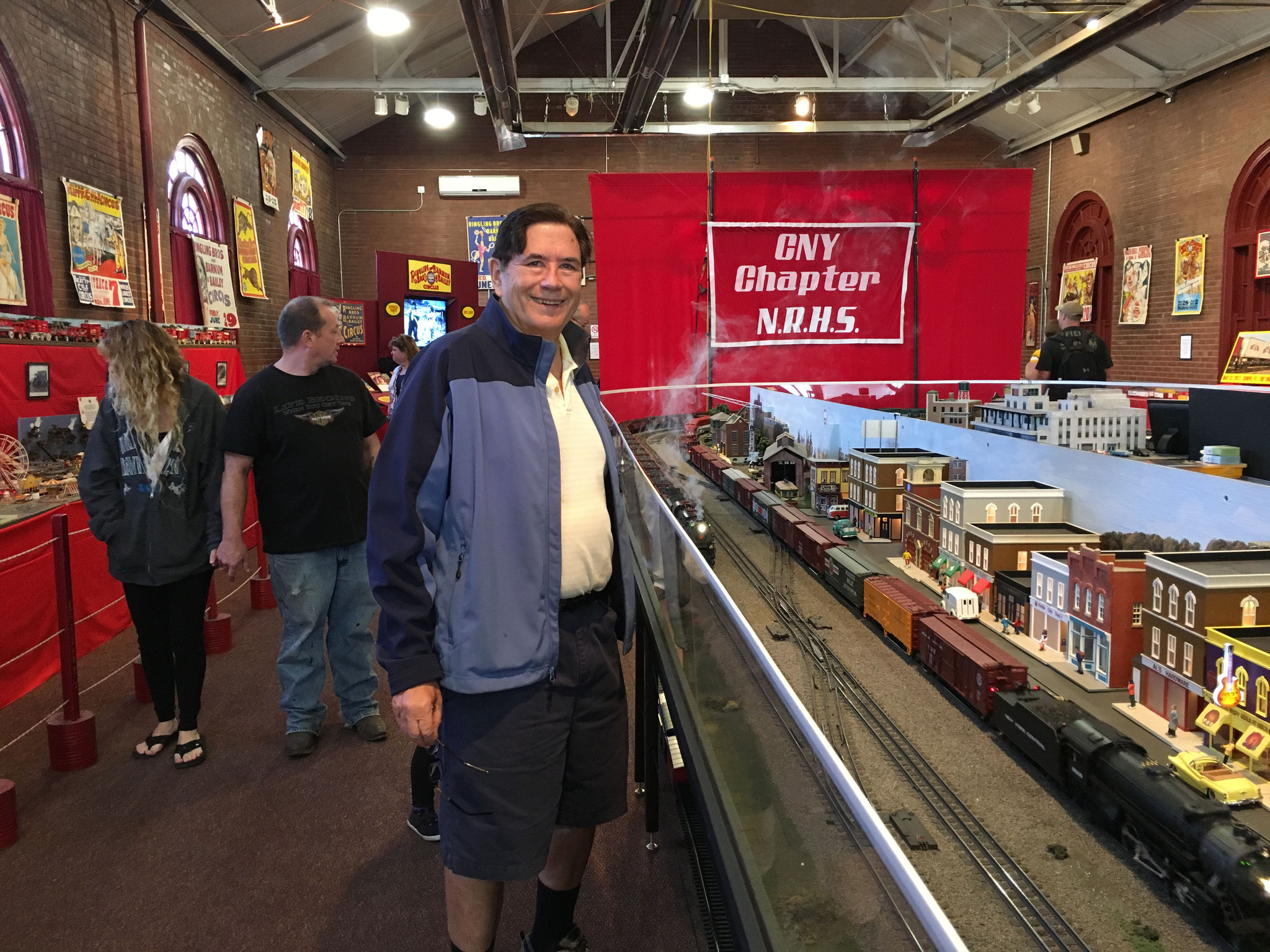 John admires the model trains at the state fair