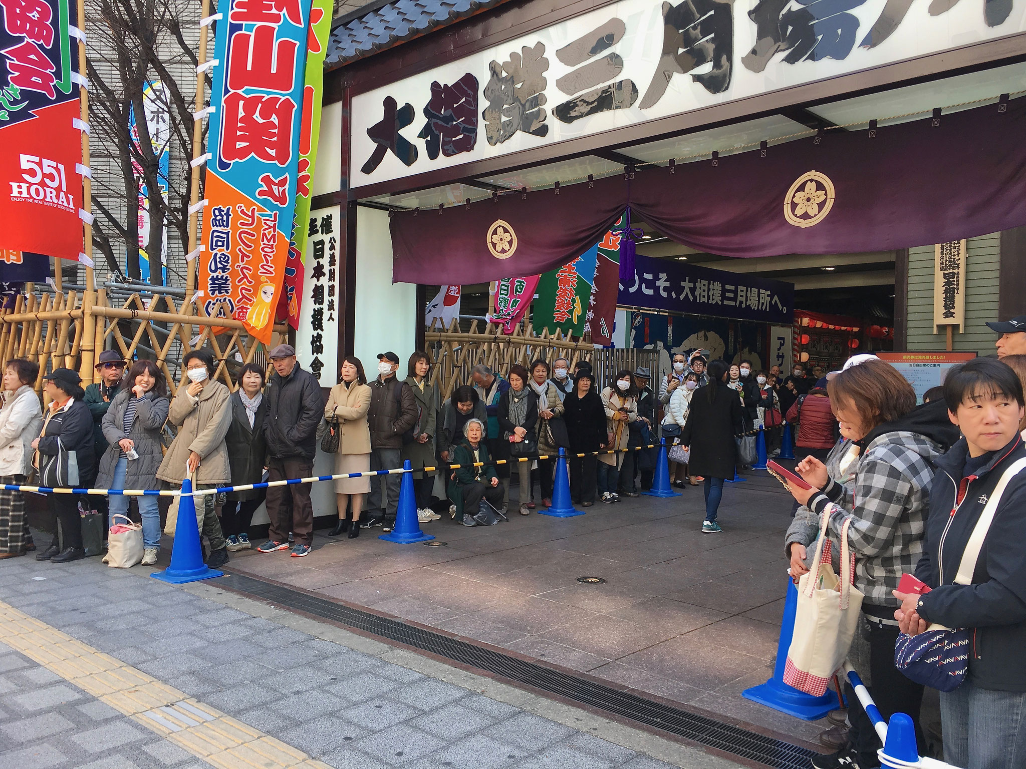 Spectators waiting for the leaders of the tournament to arrive.