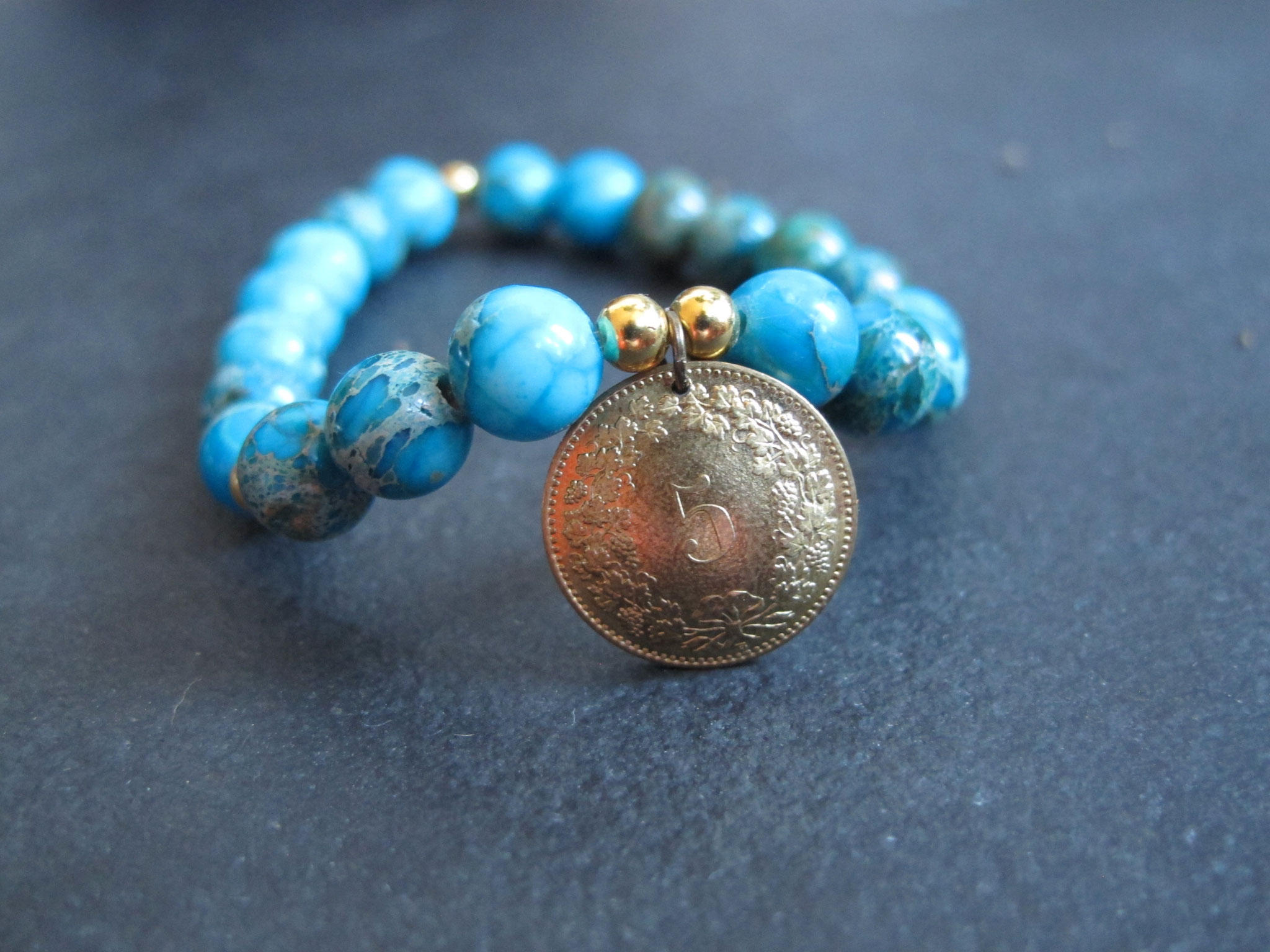 Turquoise coloured jasper with 5-Rappen charm (sold)