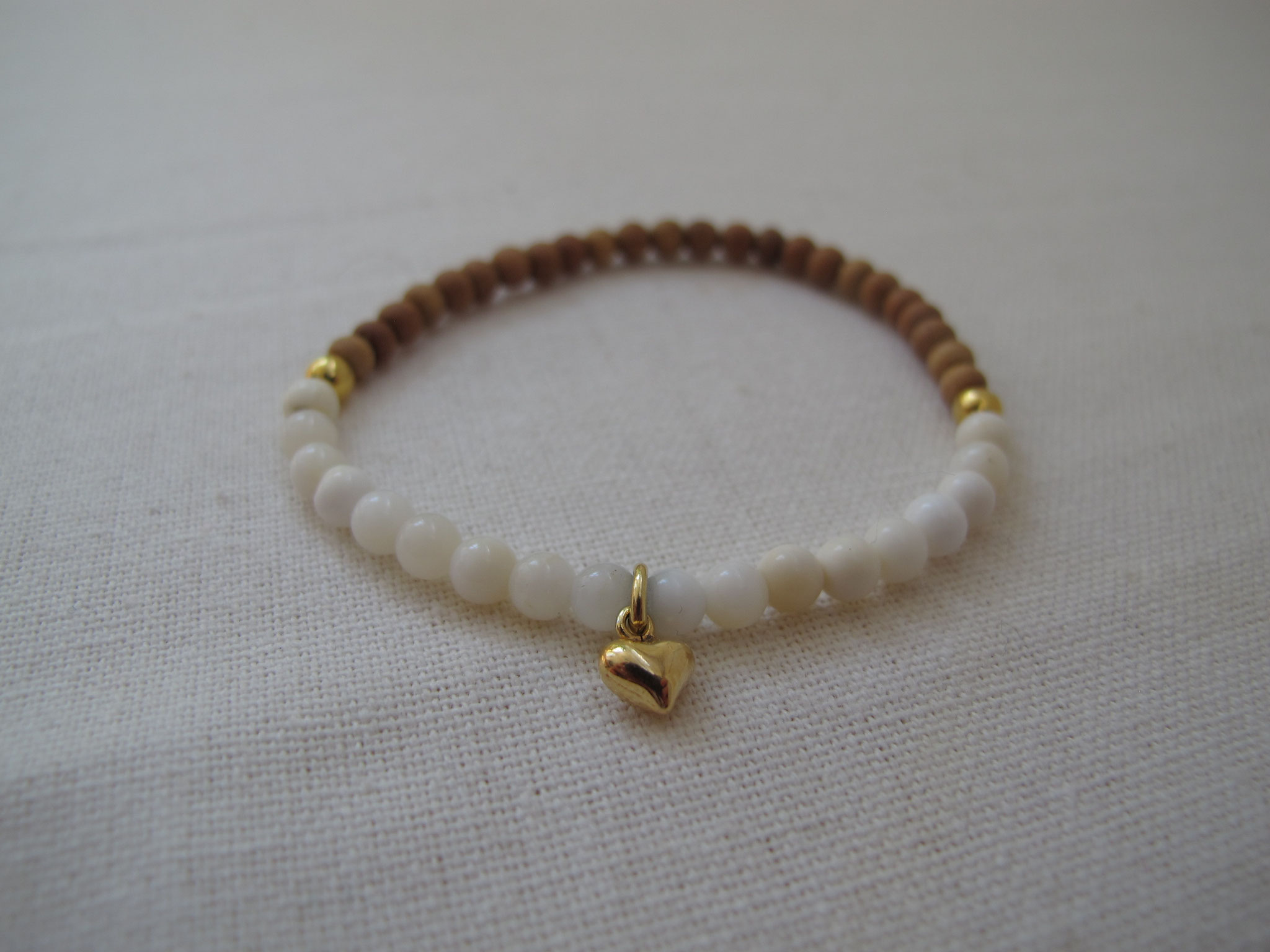 White opal, sandalwood and gold-coated heart pendant