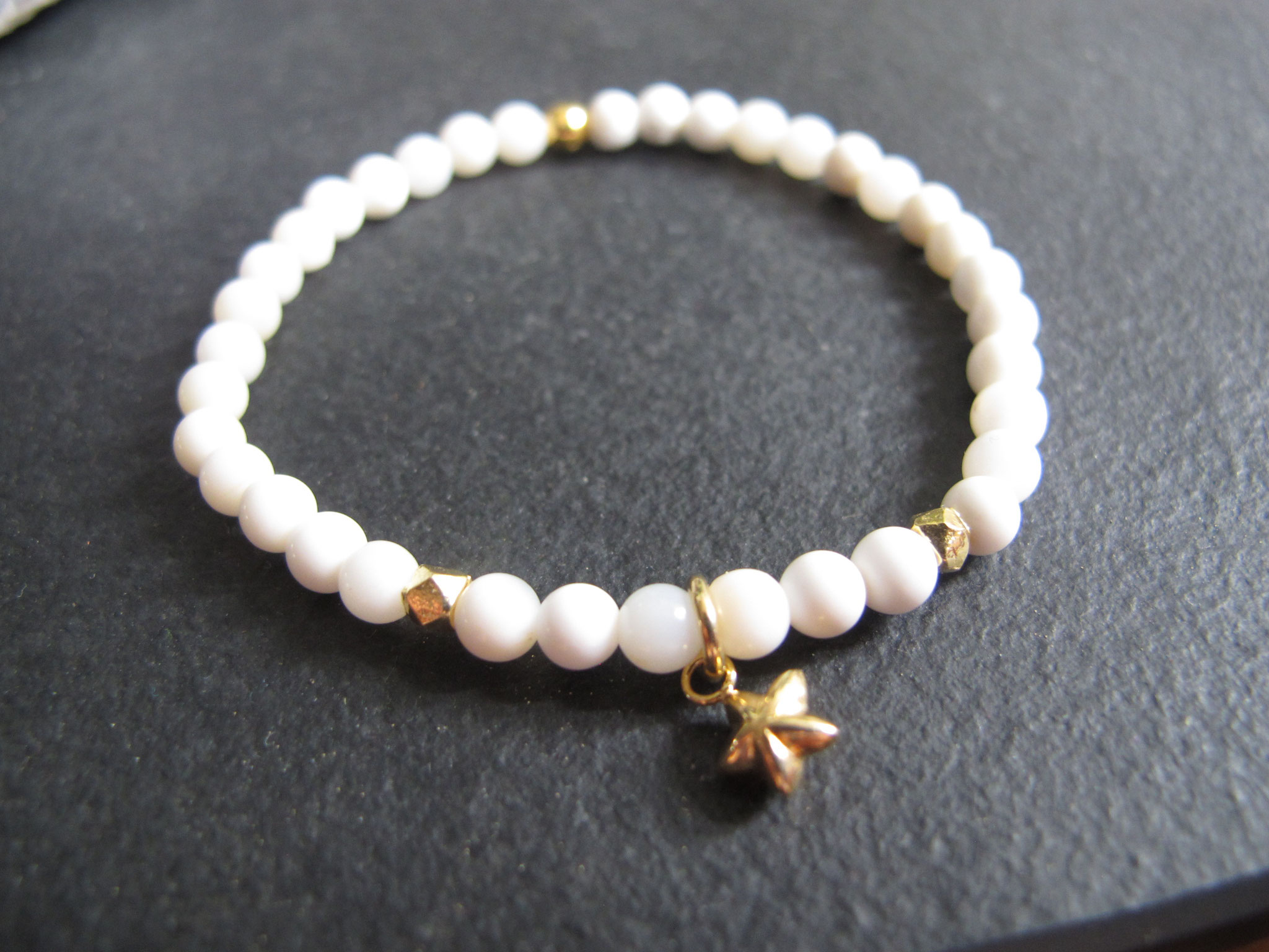 White jade with gold details and star pendant