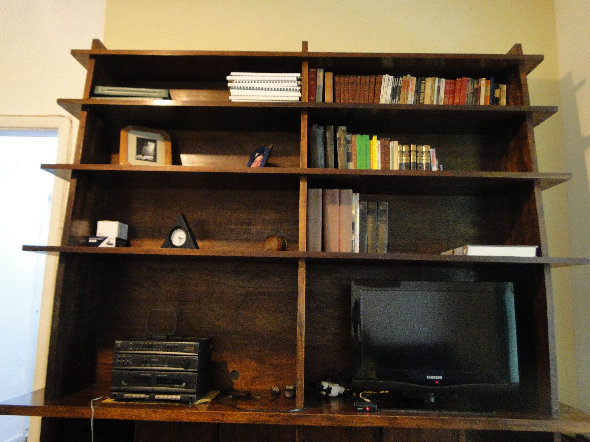 shelf for the television and books in three languages