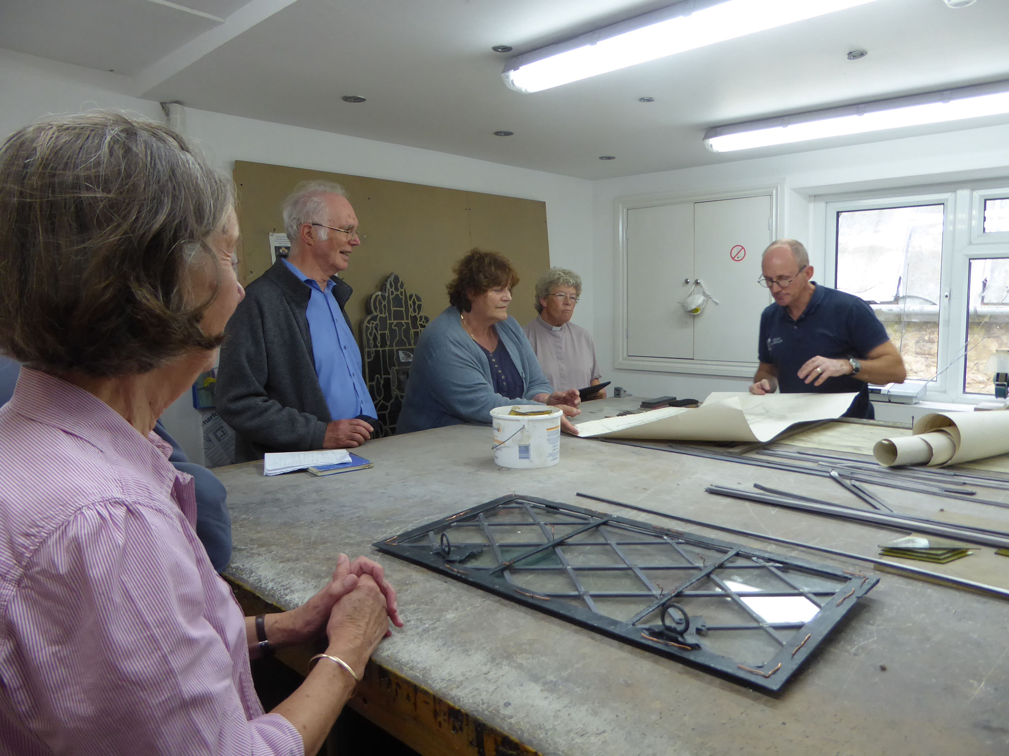 A group from the Village visits Heritage Glass to see renovation in progress