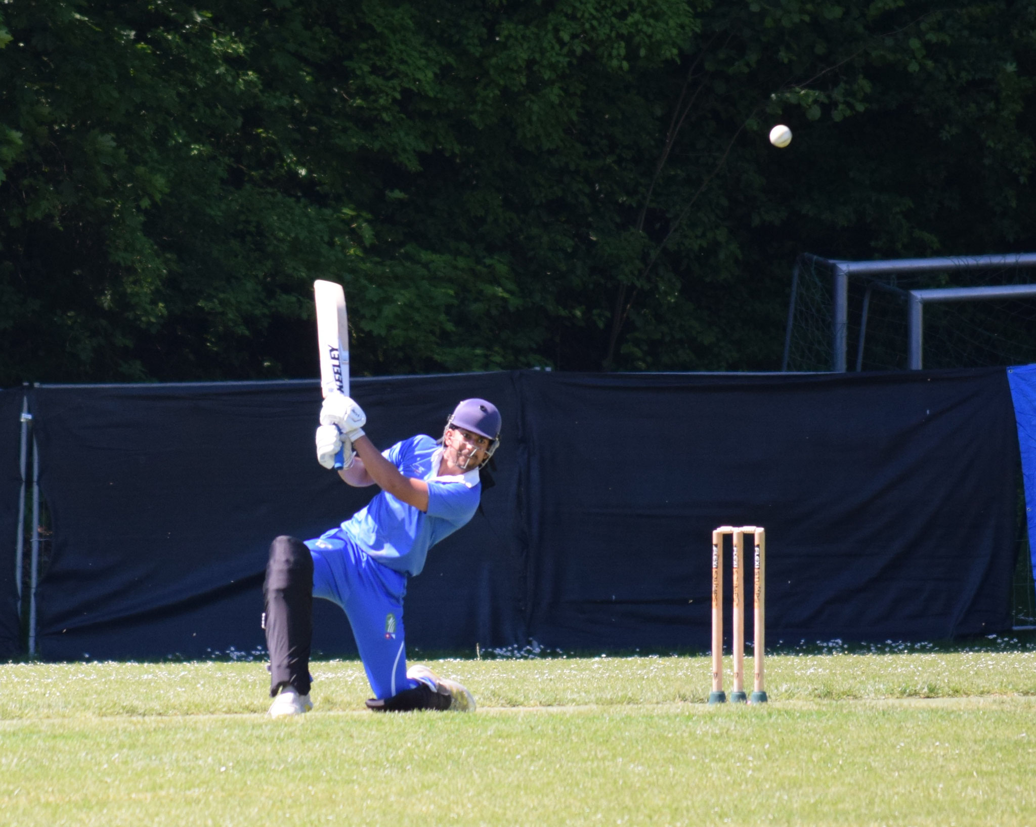 Another ball is helped on its way to the boundary line by captain Avneet.