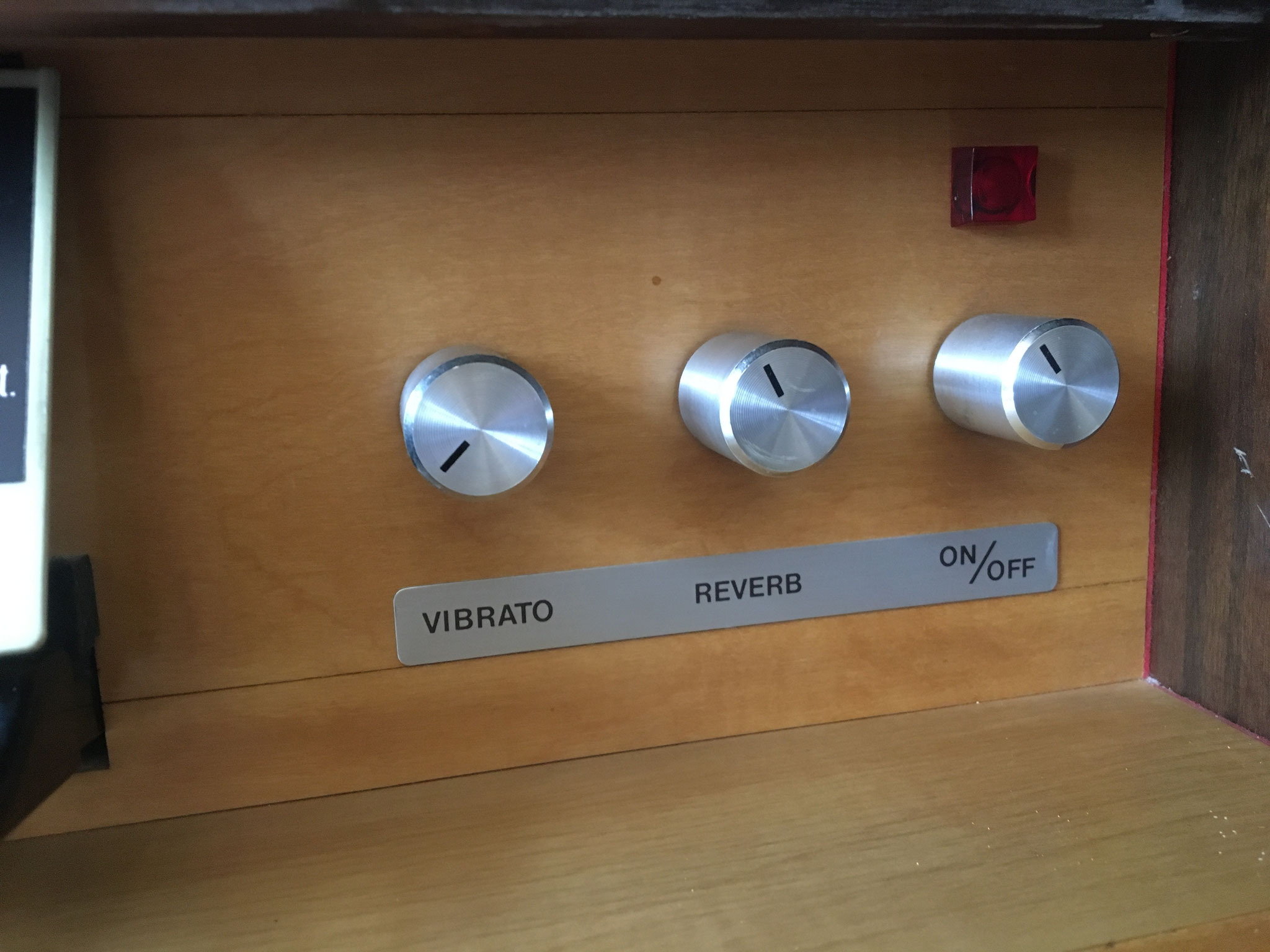 Controls for vibrato, reverb and on/off switch