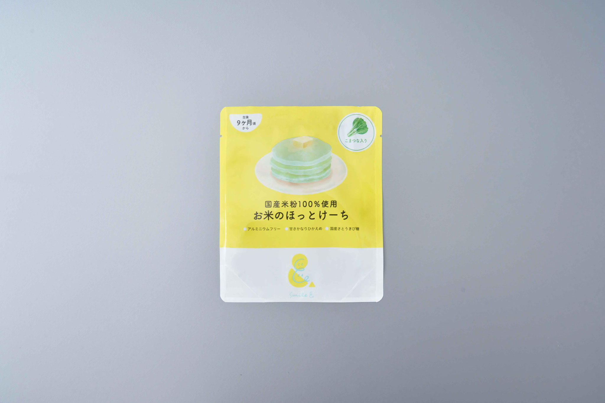 <div style=" font-size:10px; font-weight:bold;"> お米のほっとけーち こまつな入り </div> <div style=" font-size:10px;"> 国産米粉をベースに、こまつなの粉末をミックスしたホットケーキミックス粉(アルミニウムフリー) </div>