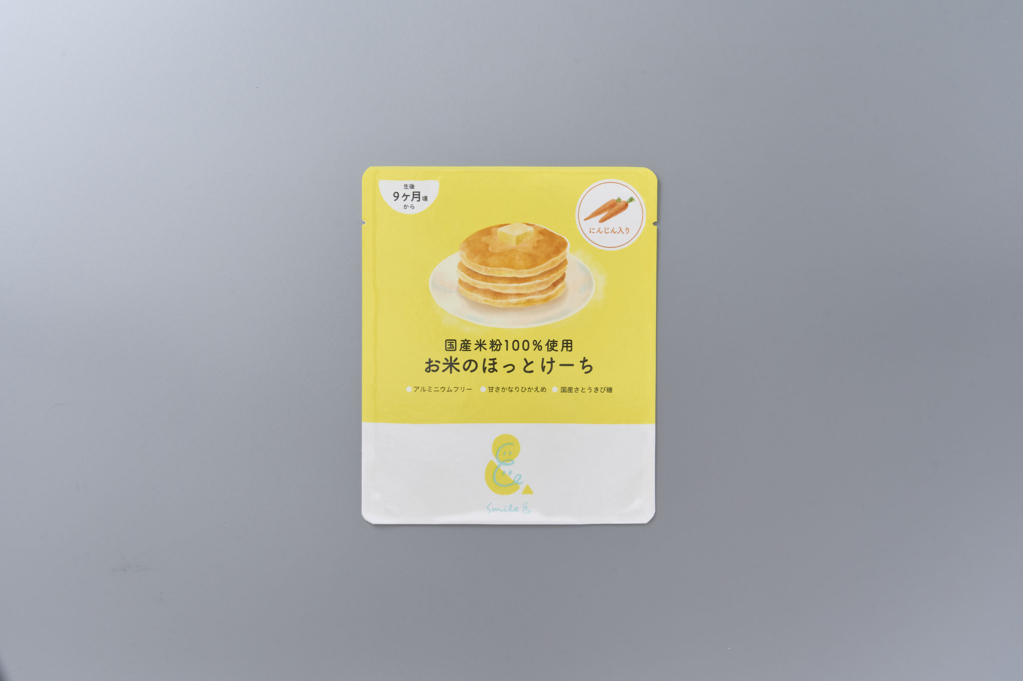 <div style=" font-size:10px; font-weight:bold;"> お米のほっとけーち　にんじん入り </div>  <div style=" font-size:10px;"> 国産米粉をベースに、にんじんの粉末をミックスしたホットケーキミックス粉（アルミニウムフリー） </div>
