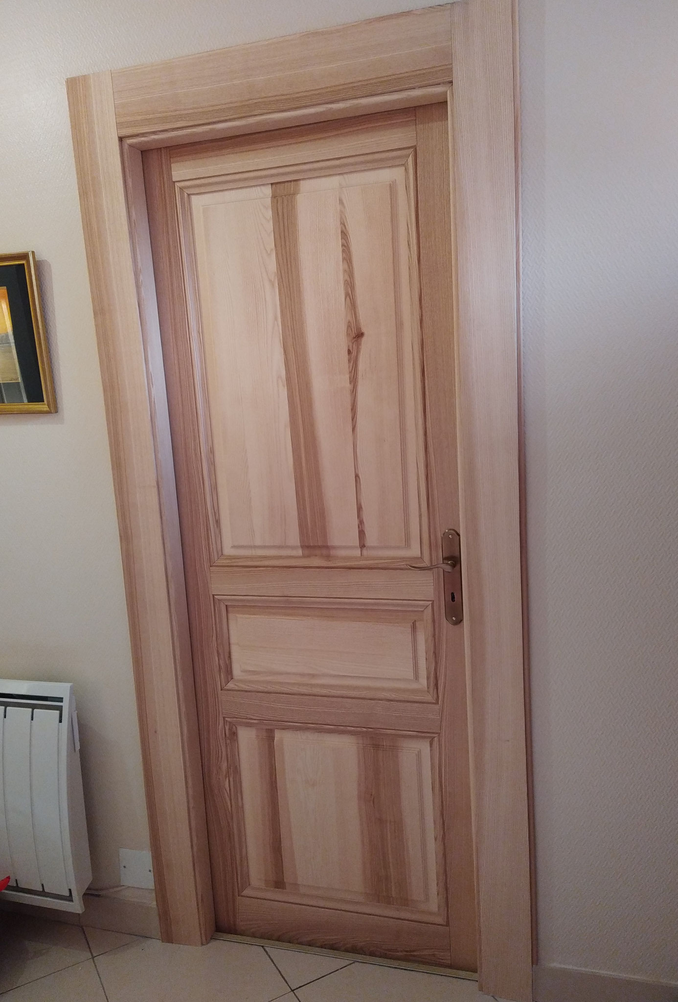 Porte en frêne et olivier