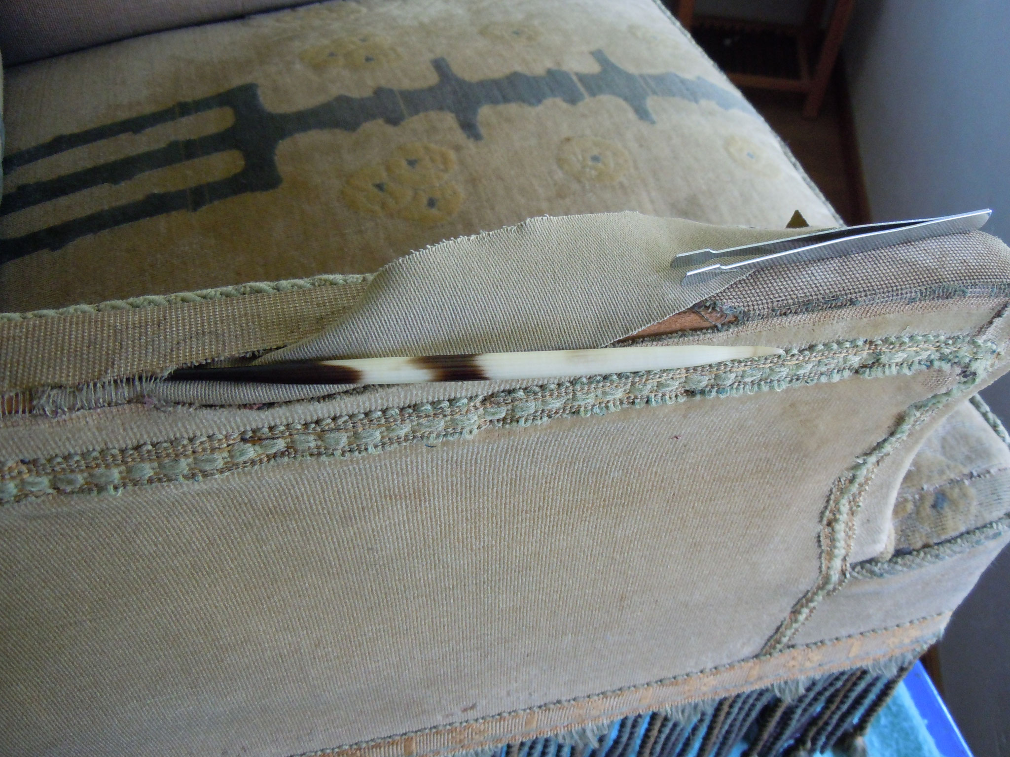 Squeezing a piece of fabric under the ripped area somehow.