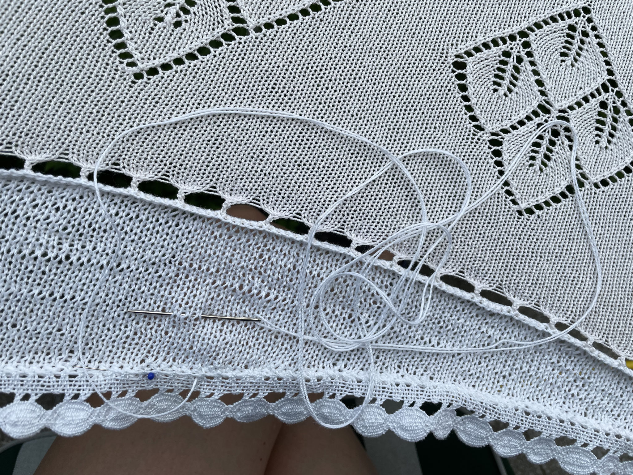 This time I do sew it to the crochet line on the knitting as technically it is the only way to go to fix it lying straight "on top" of the patches. 