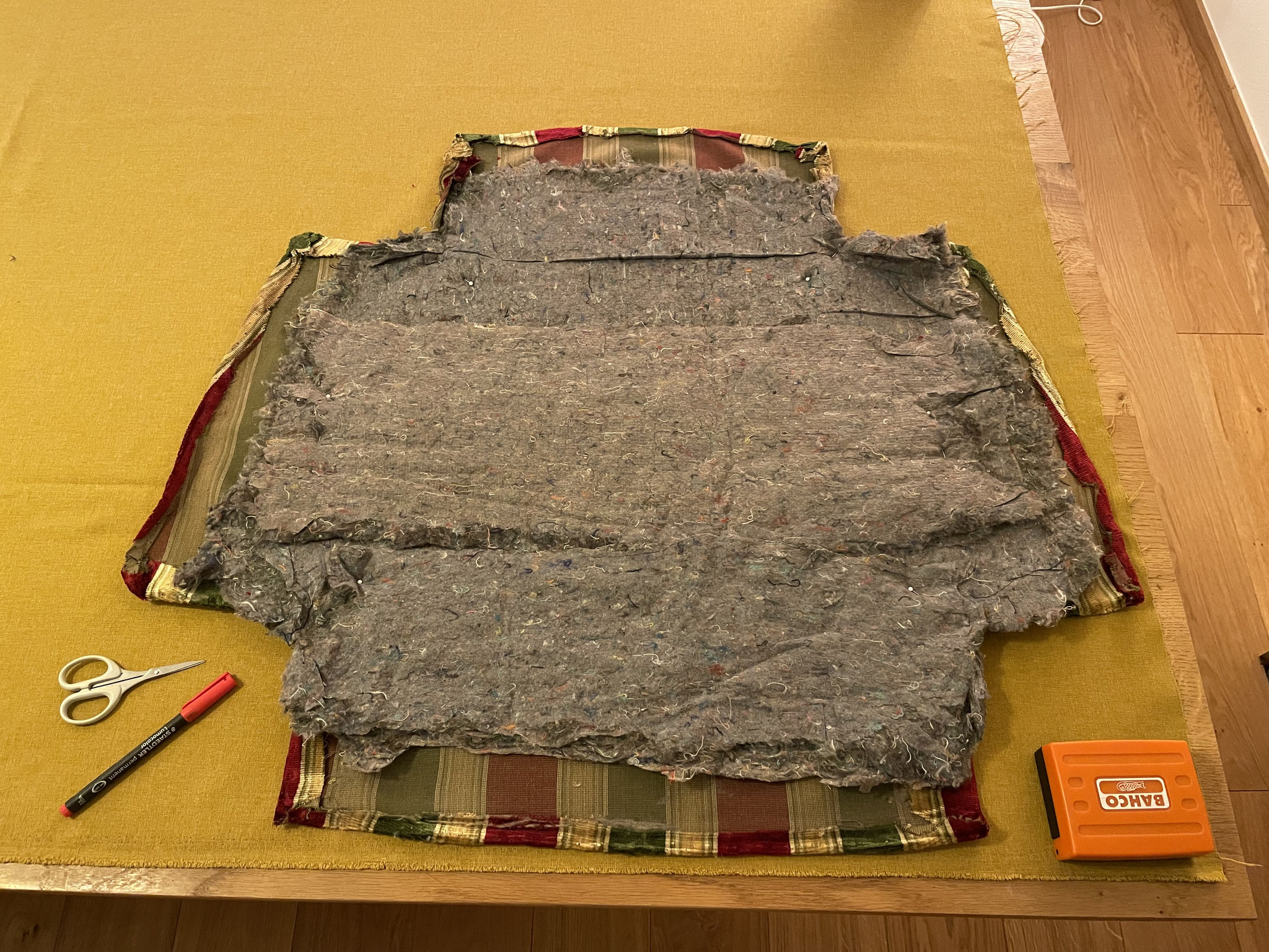 Copying the seat cover's pattern from the original. 