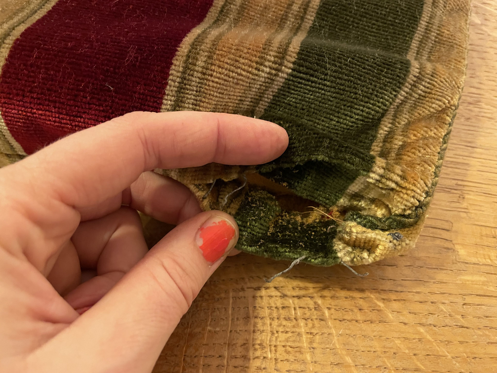 I undo the lower seam.