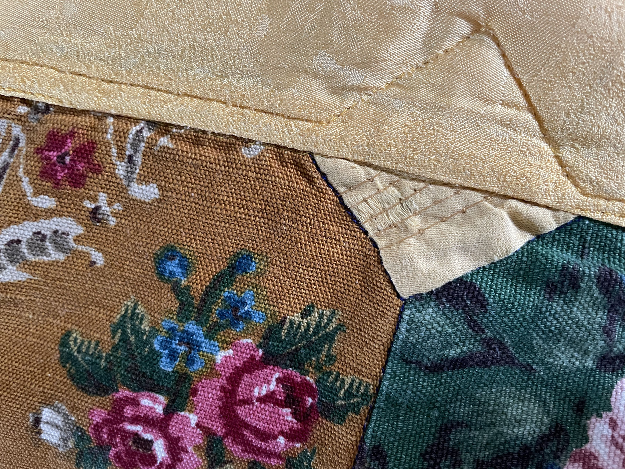 Secure weak parts of fabric with reinforcing stitches.