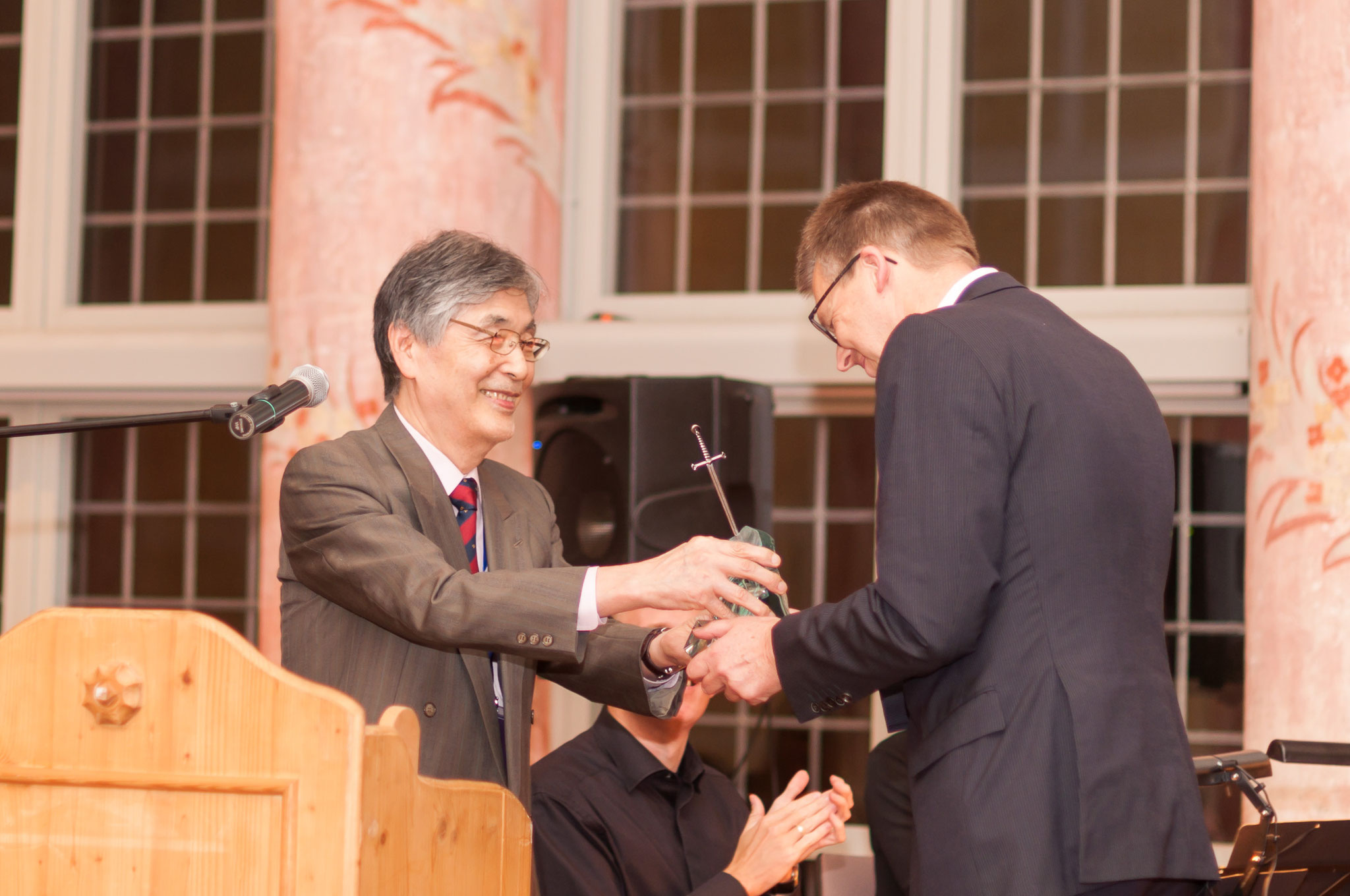 Prof. Frank Vollertsen receives the knighthood from Prof. Isamu Miyamoto at LANE 2016