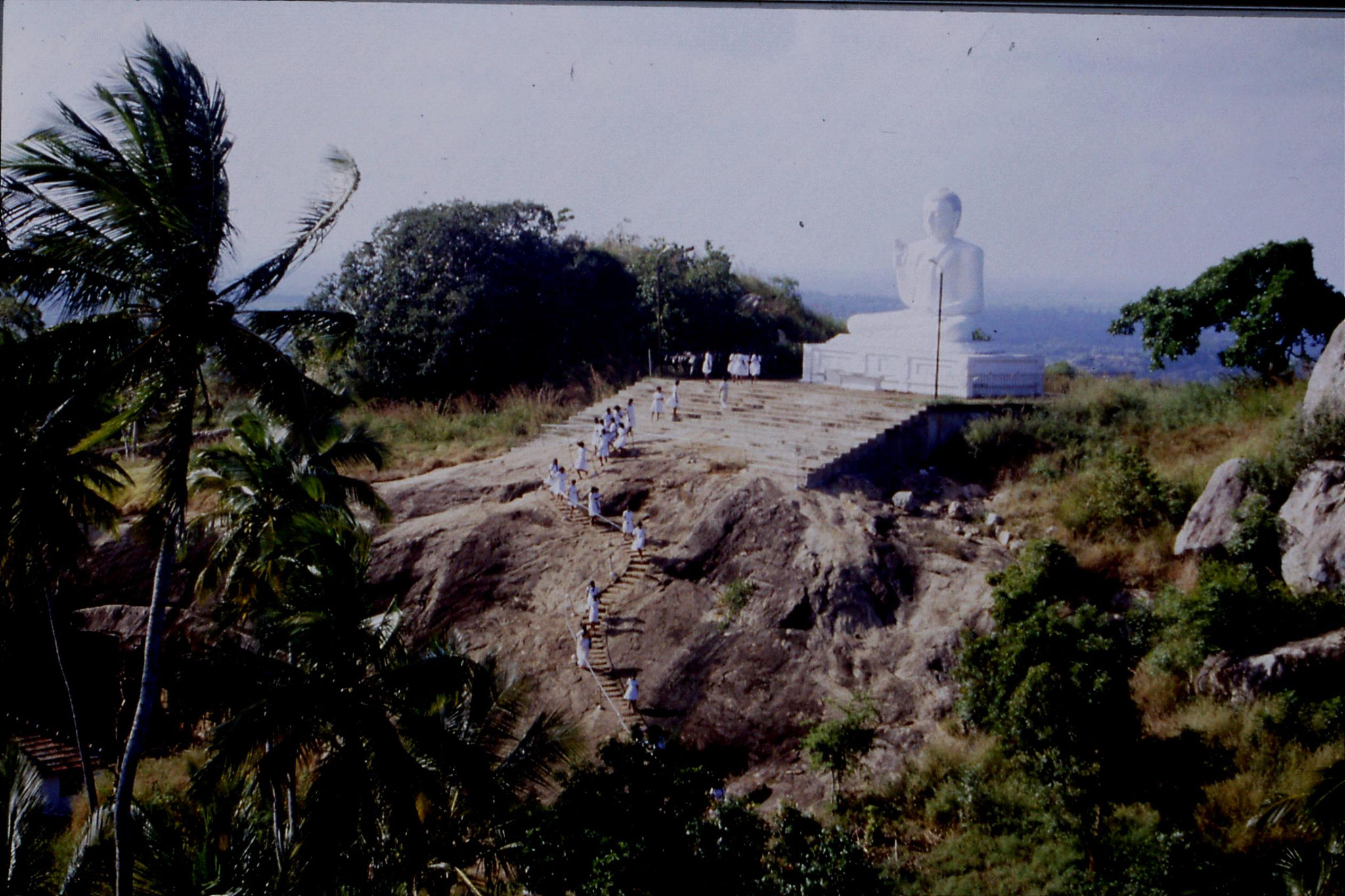 103/3: 8/2/1990 Buddha statue and school girls at Mihintale