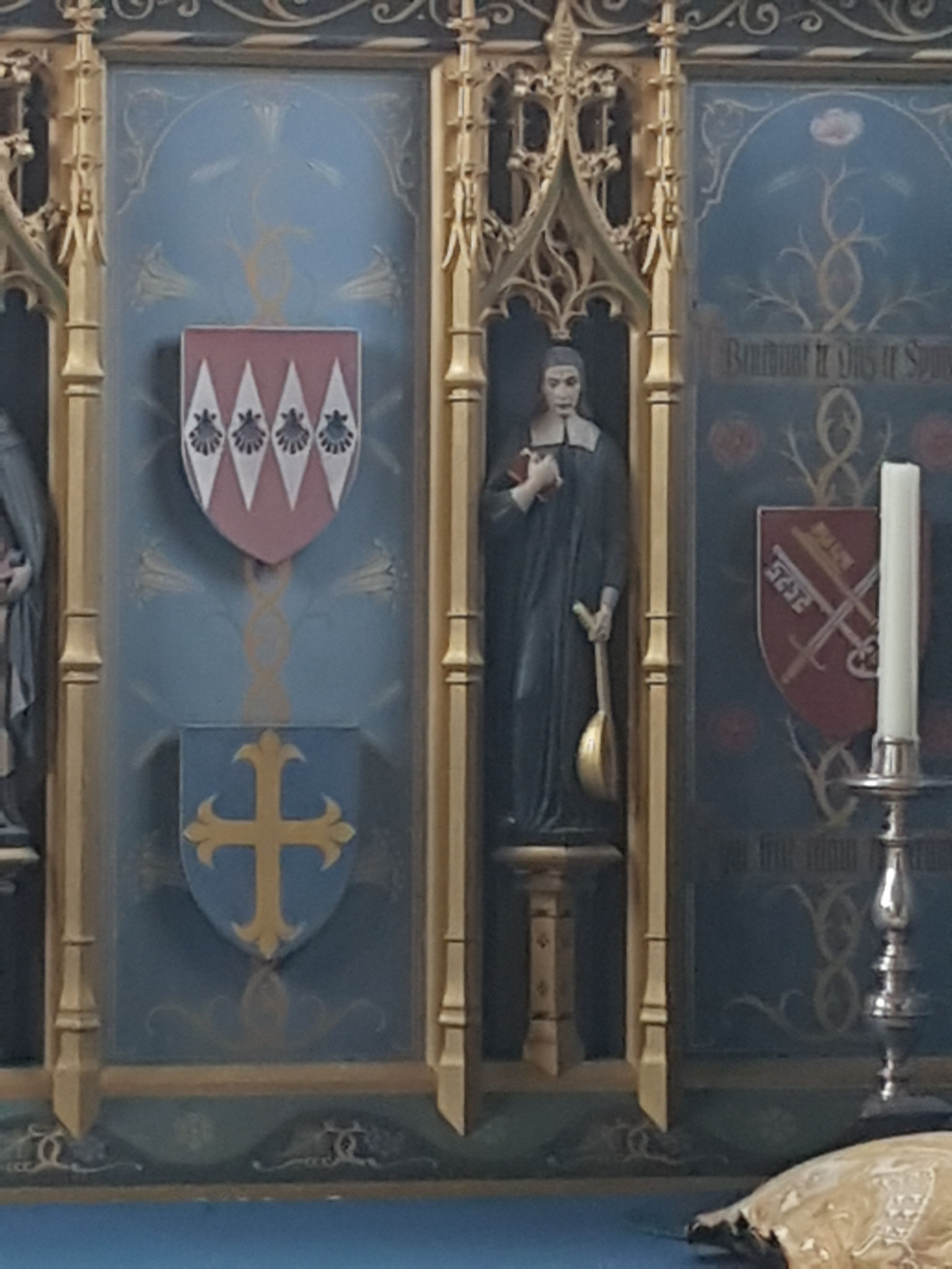 George Herbert with mandolin on the Neo-Gothic 1930s reredos