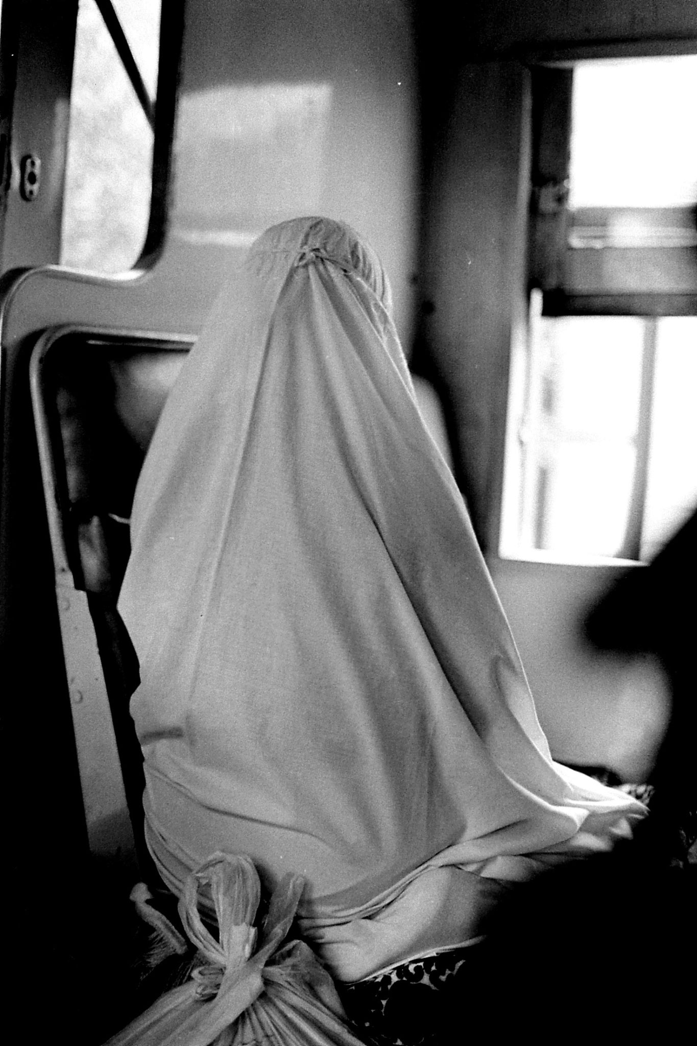 21/6/1990: 33: woman praying on train