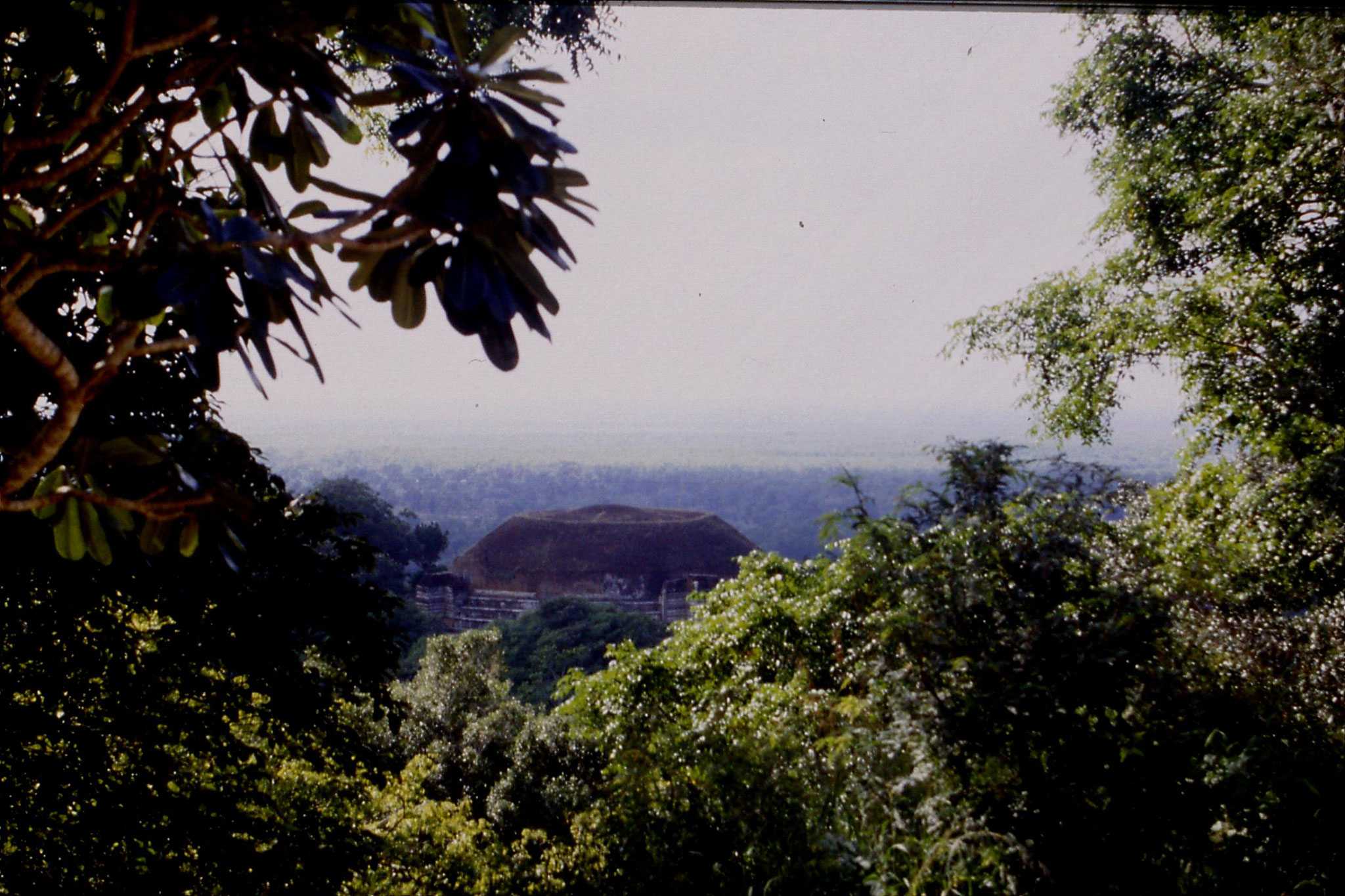 104/1: 8/2/1990 Kantaka Cetiya at Mihintale wiht jungle behind