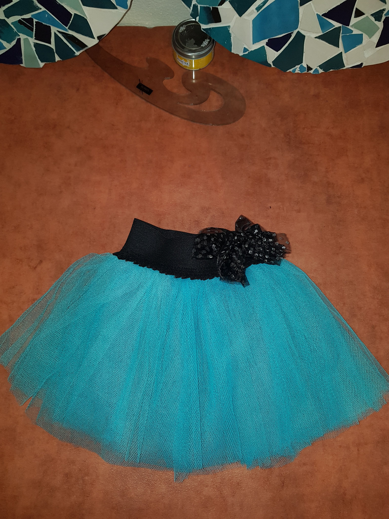 Jupe tulle bleu ciel avec noeud en tulle à paillettes