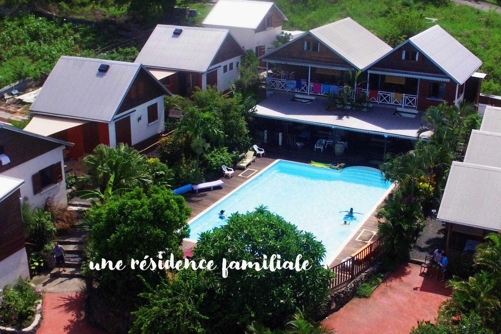 Aerial view of Le Cardinal des Grands Bleus family residence and its Creole-style bungalows in Saint-Leu