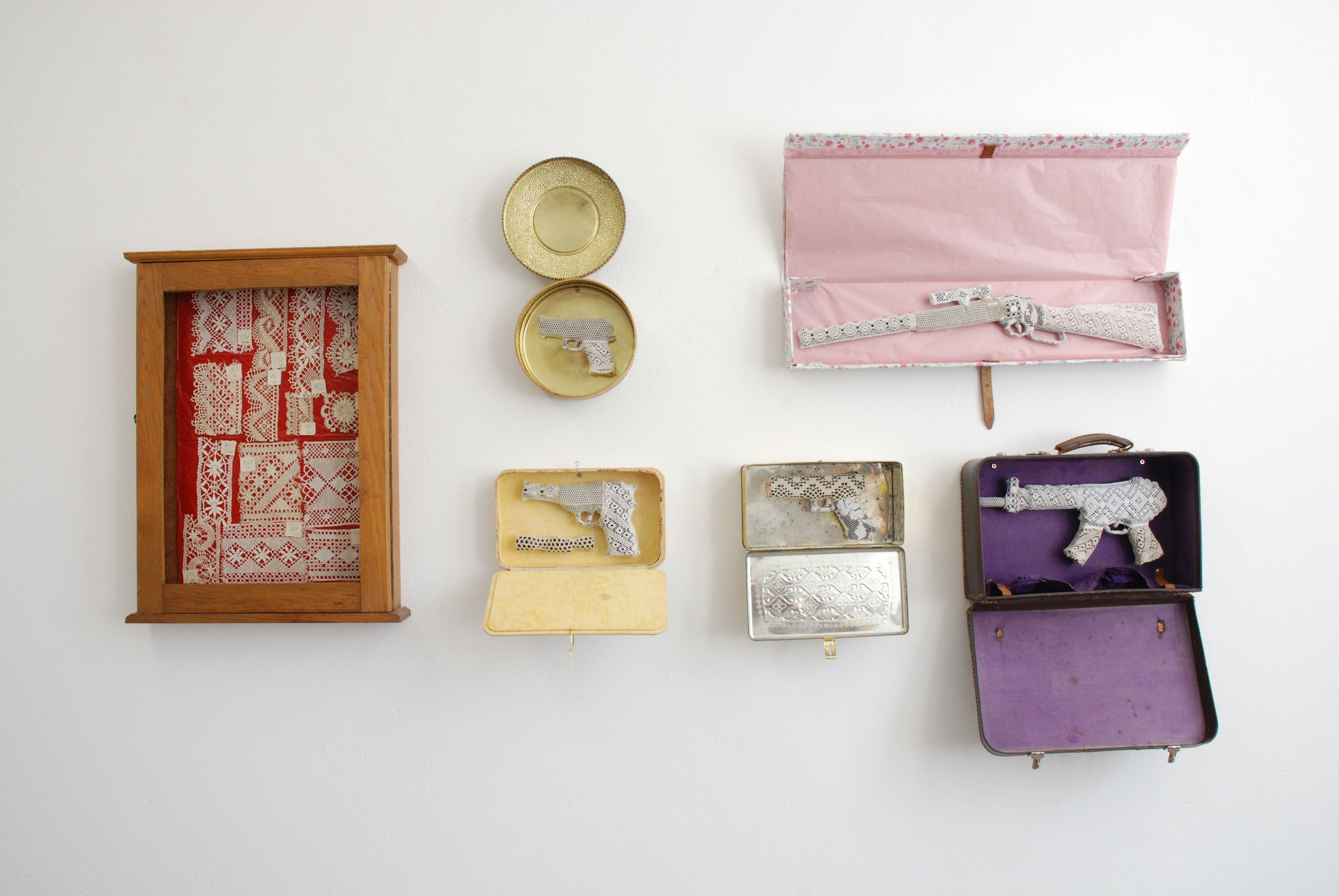 installation with mixed media (lace, boxes, suitcase, etc.)