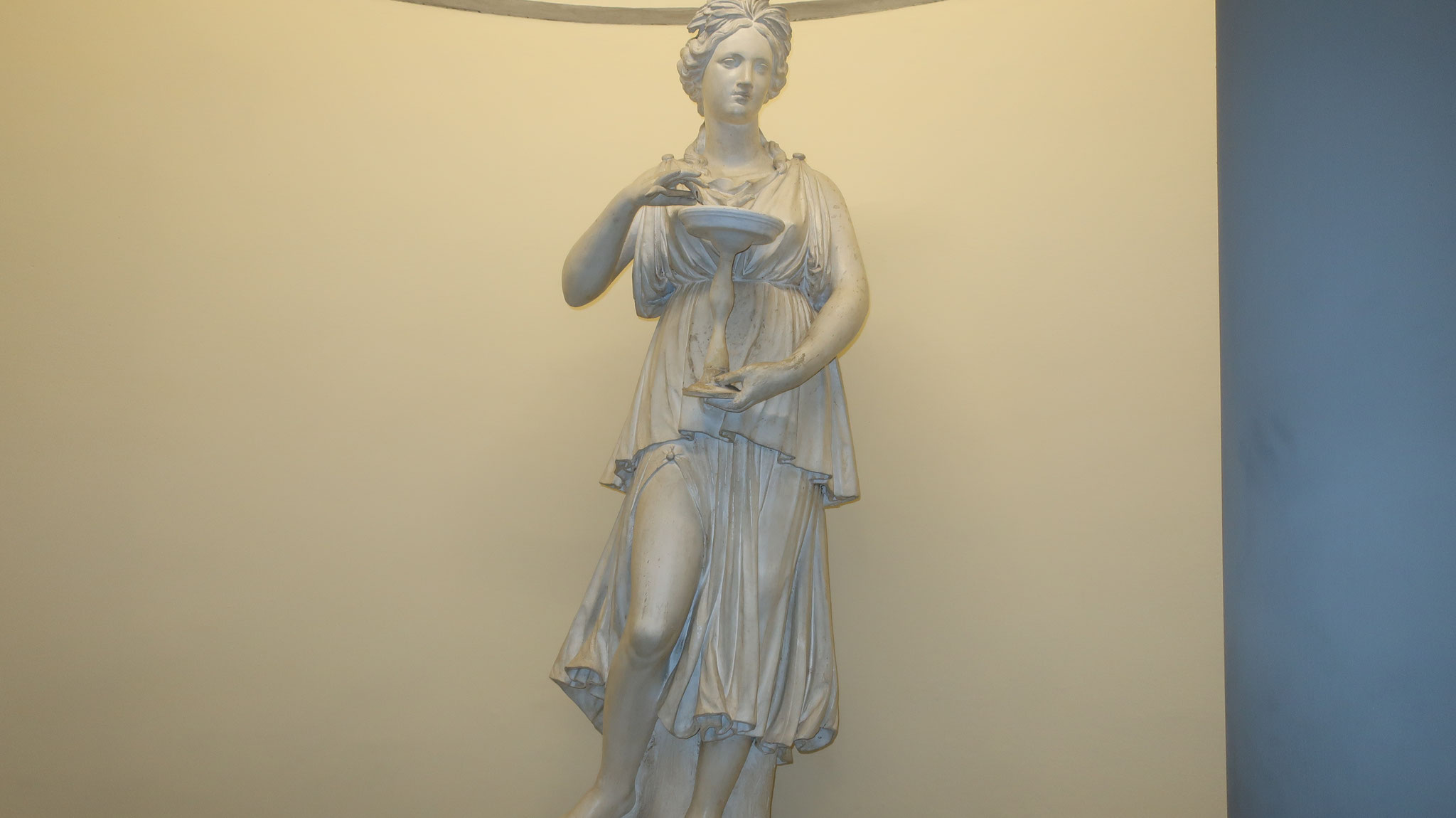 The statue of Hygieia, the daughter of Asclepius. The cup she holds is called the "Cup of Hygieia" and is a symbol of pharmacy.