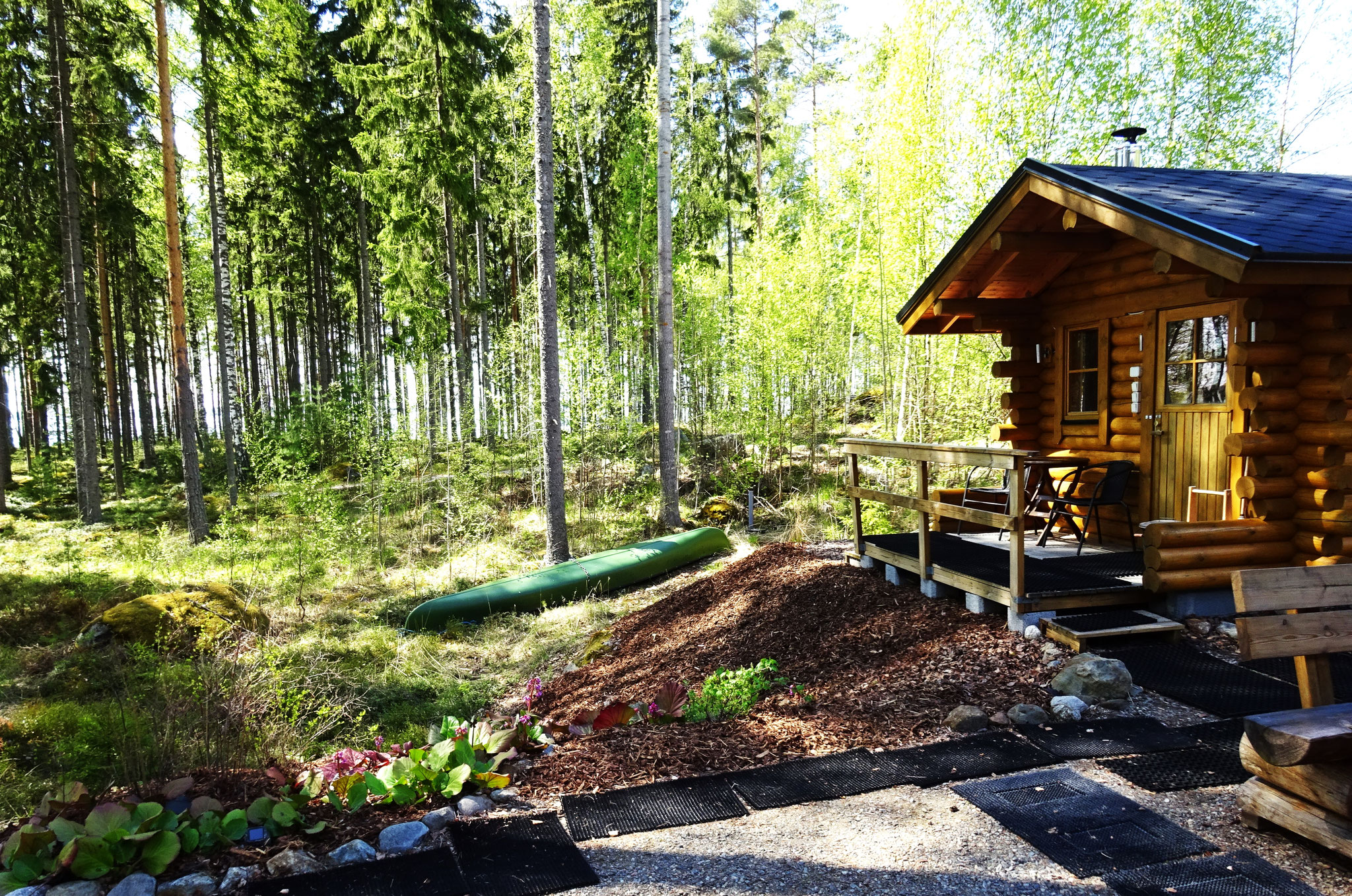 Traditional Finnish log cabin sauna with lakeview