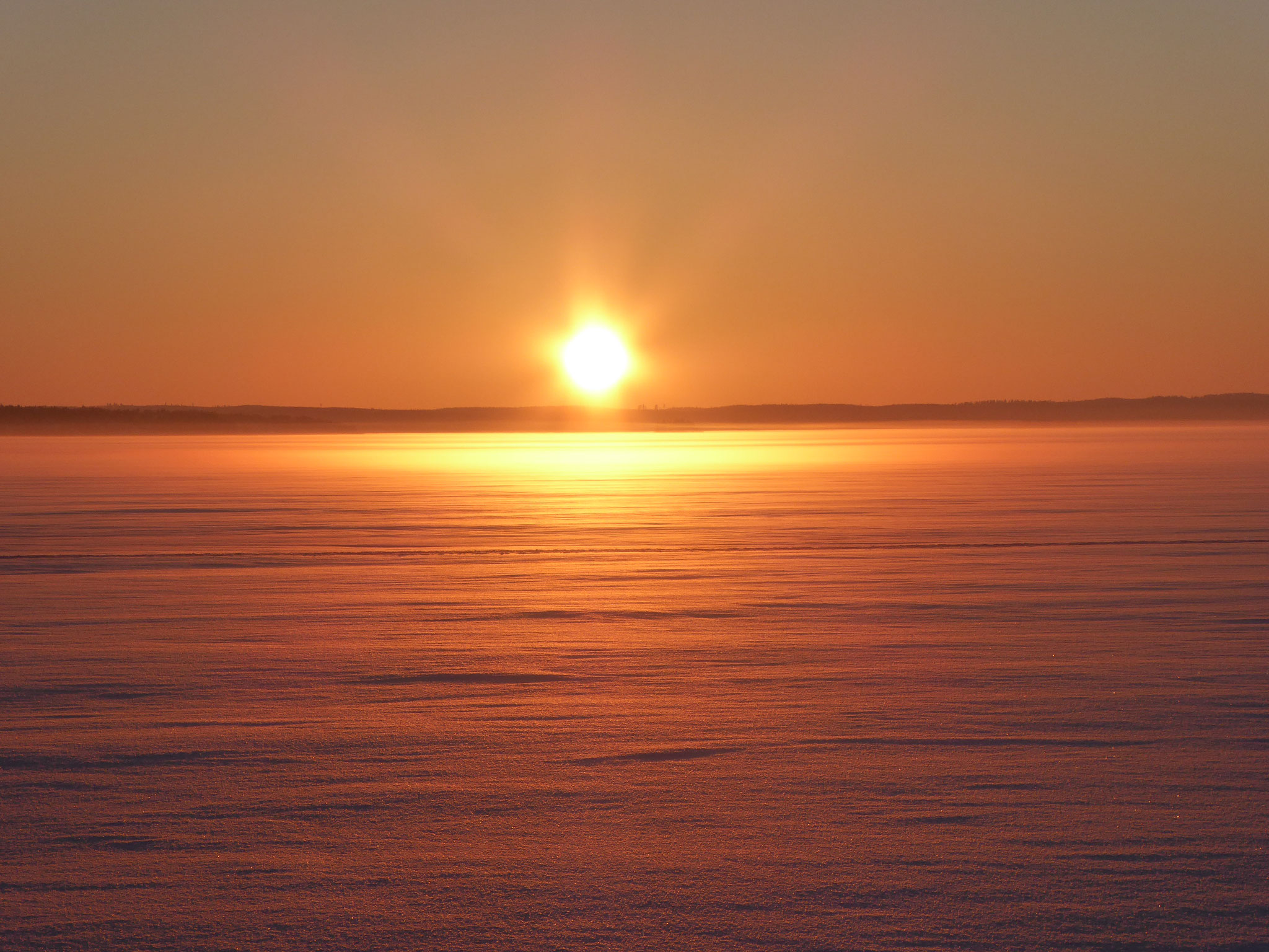 Amazing sunsets at frozen Lake Päijänne near the house