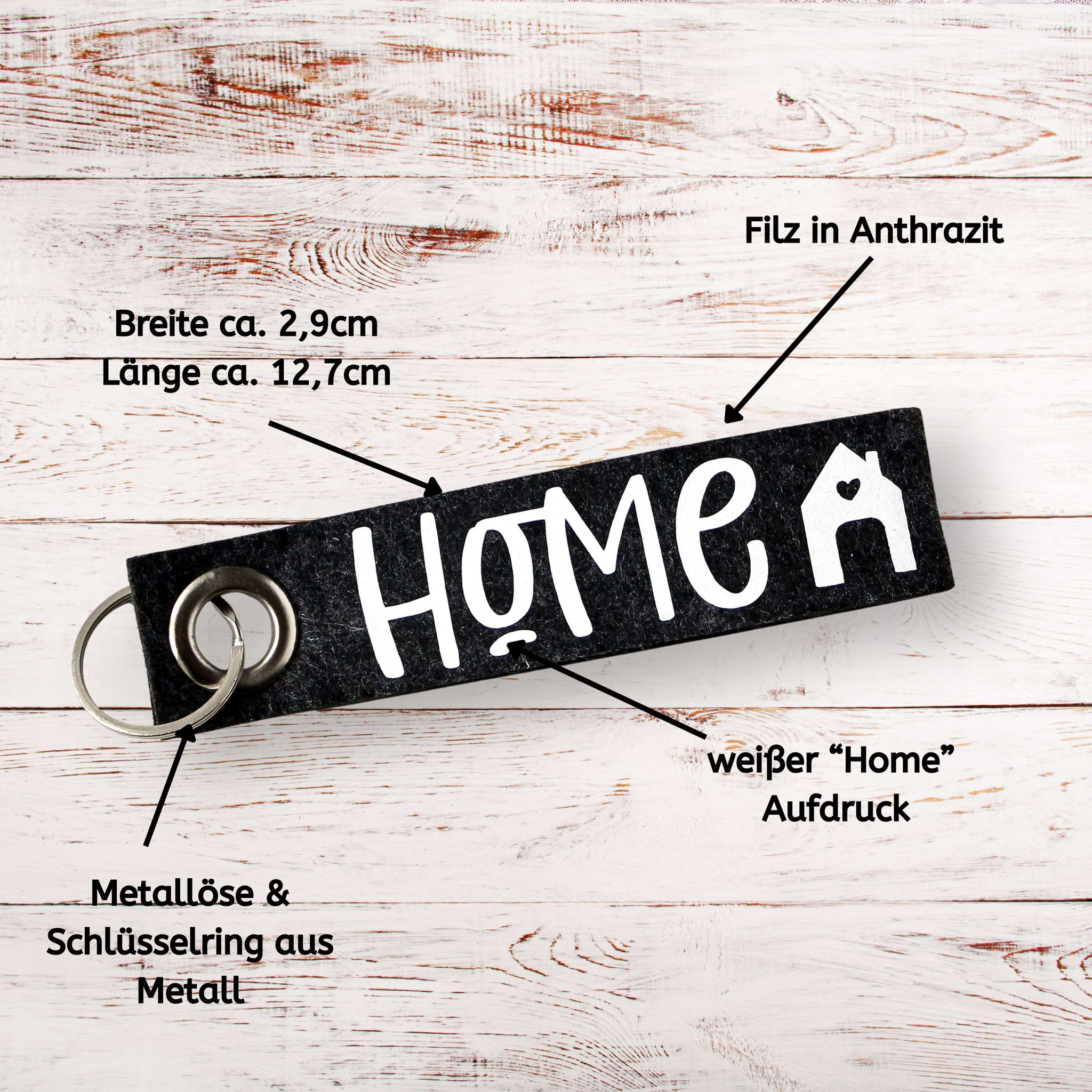 Filz-Schlüsselanhänger in Anthrazit mit „Home“-Print, Metallöse und Ring – ideales Geschenk zum Einzug oder Umzug.