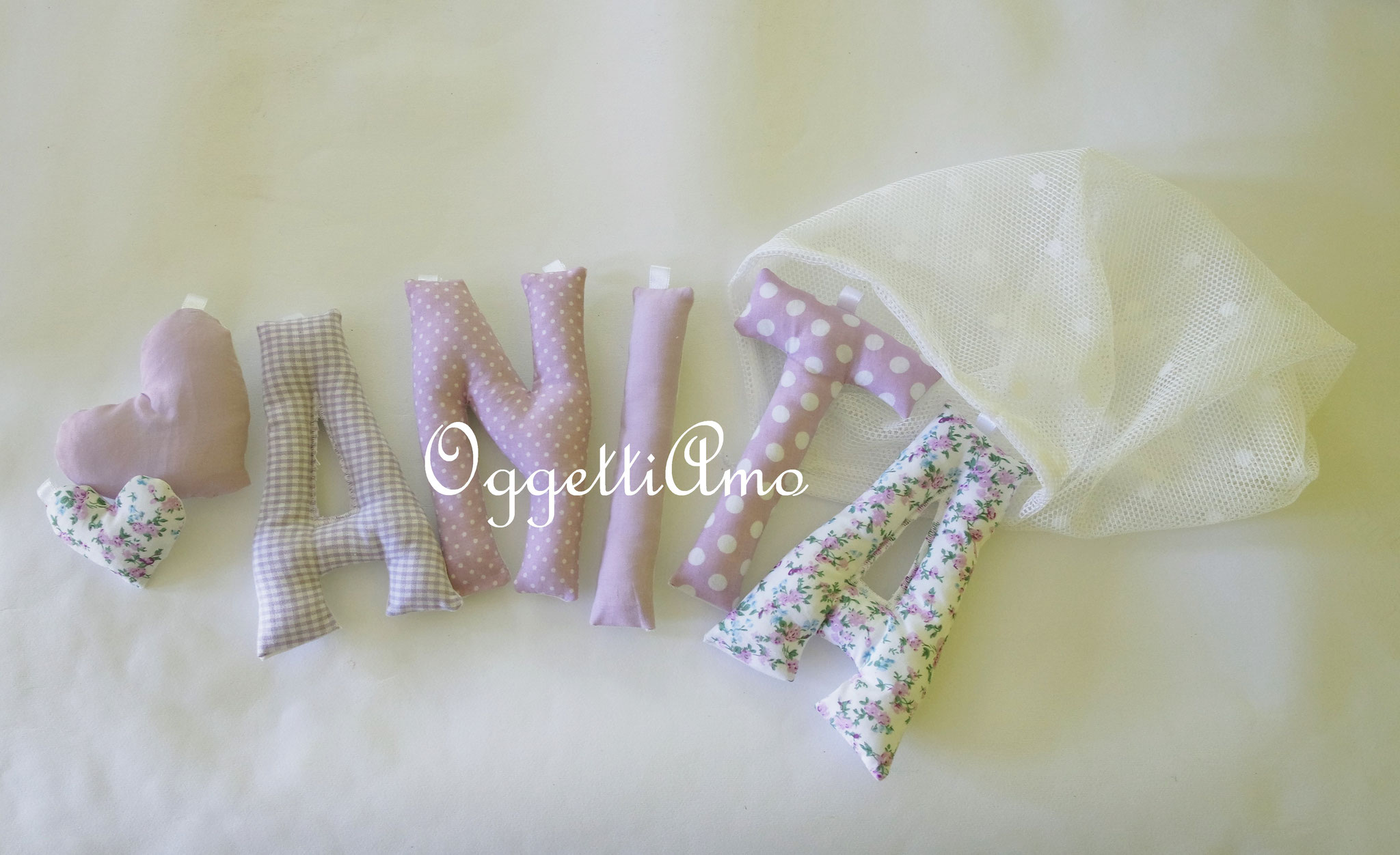 Una ghirlanda di lettere di stoffa imbottite lilla per Anita