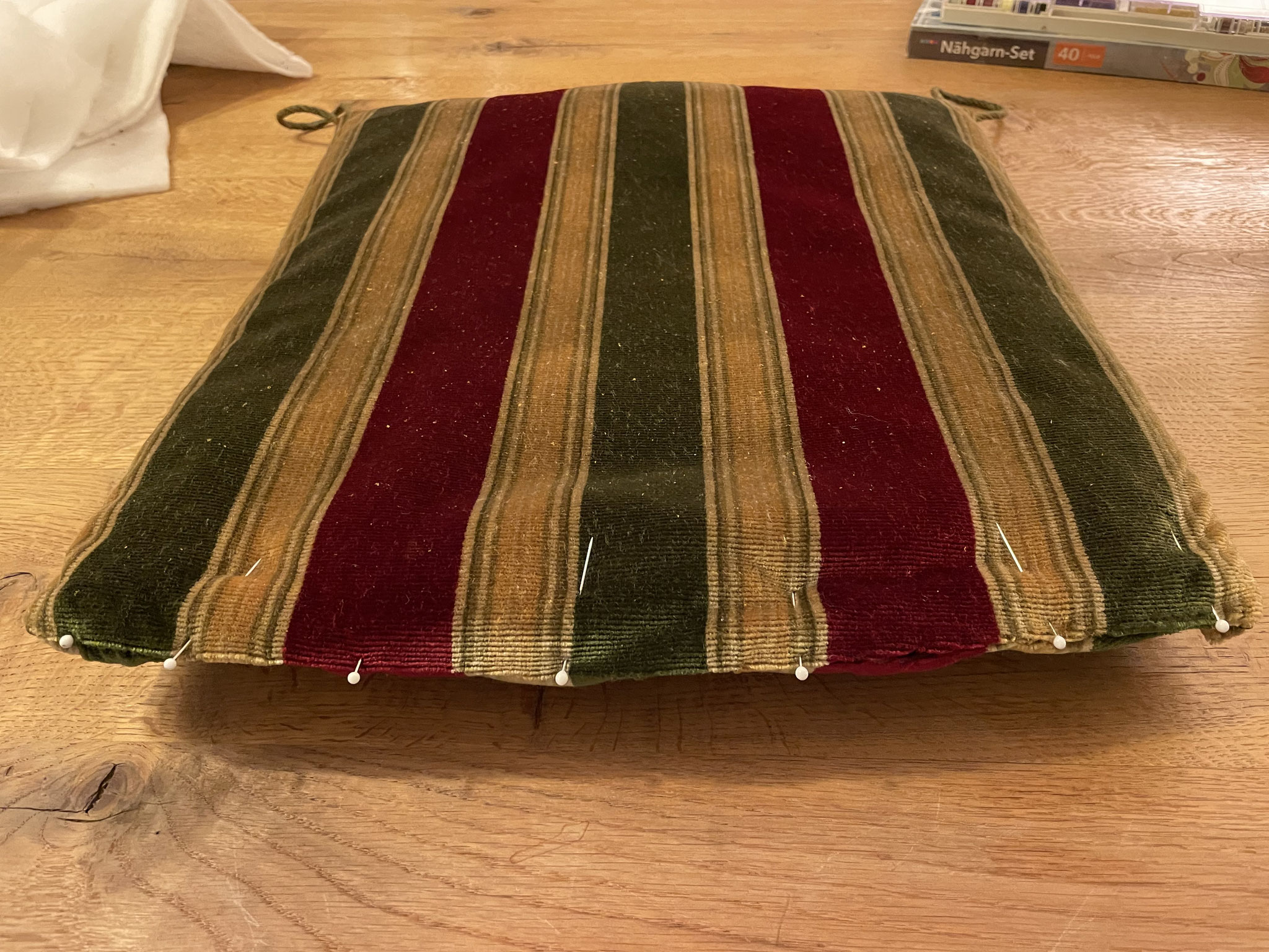 Back with the thing in its cover. Closing the lower seam again.