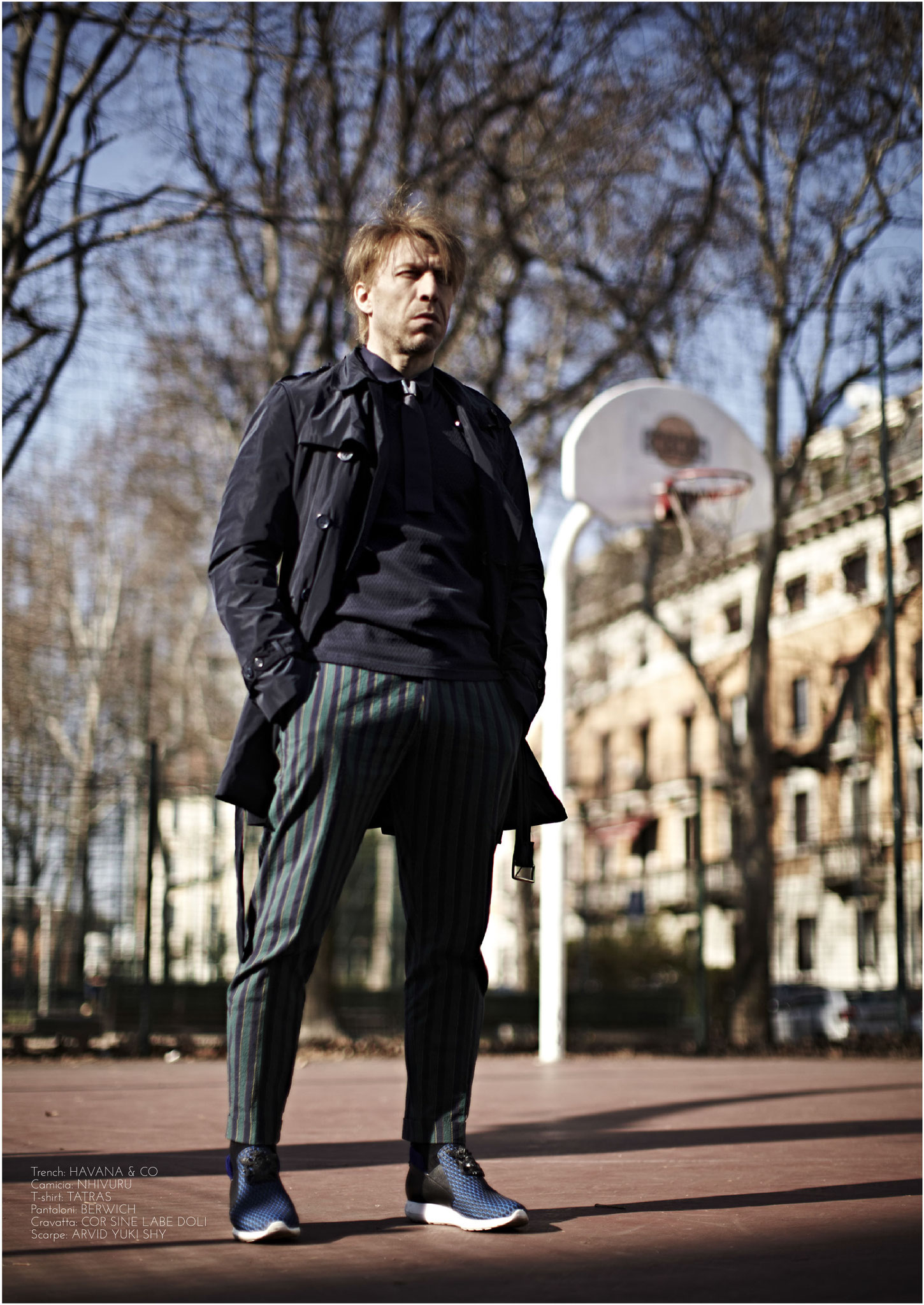 Ottaviano Blitch, Italian actor and performer, editorial street fashion portrait in a dark outfit in an urban park setting, attore performer italiano moda urbana editoriale
