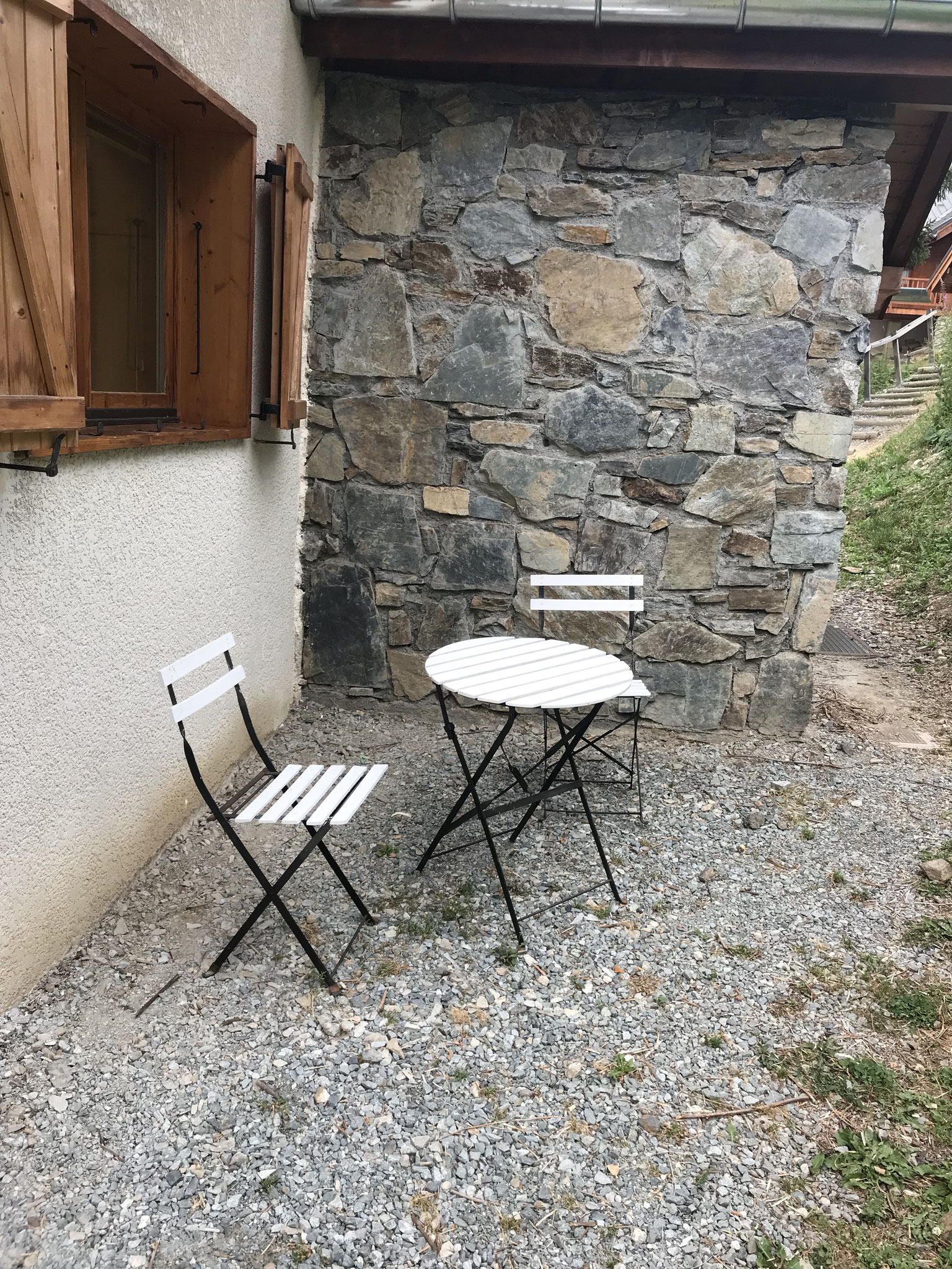 Little terrace in front of kitchen window, with morning sun