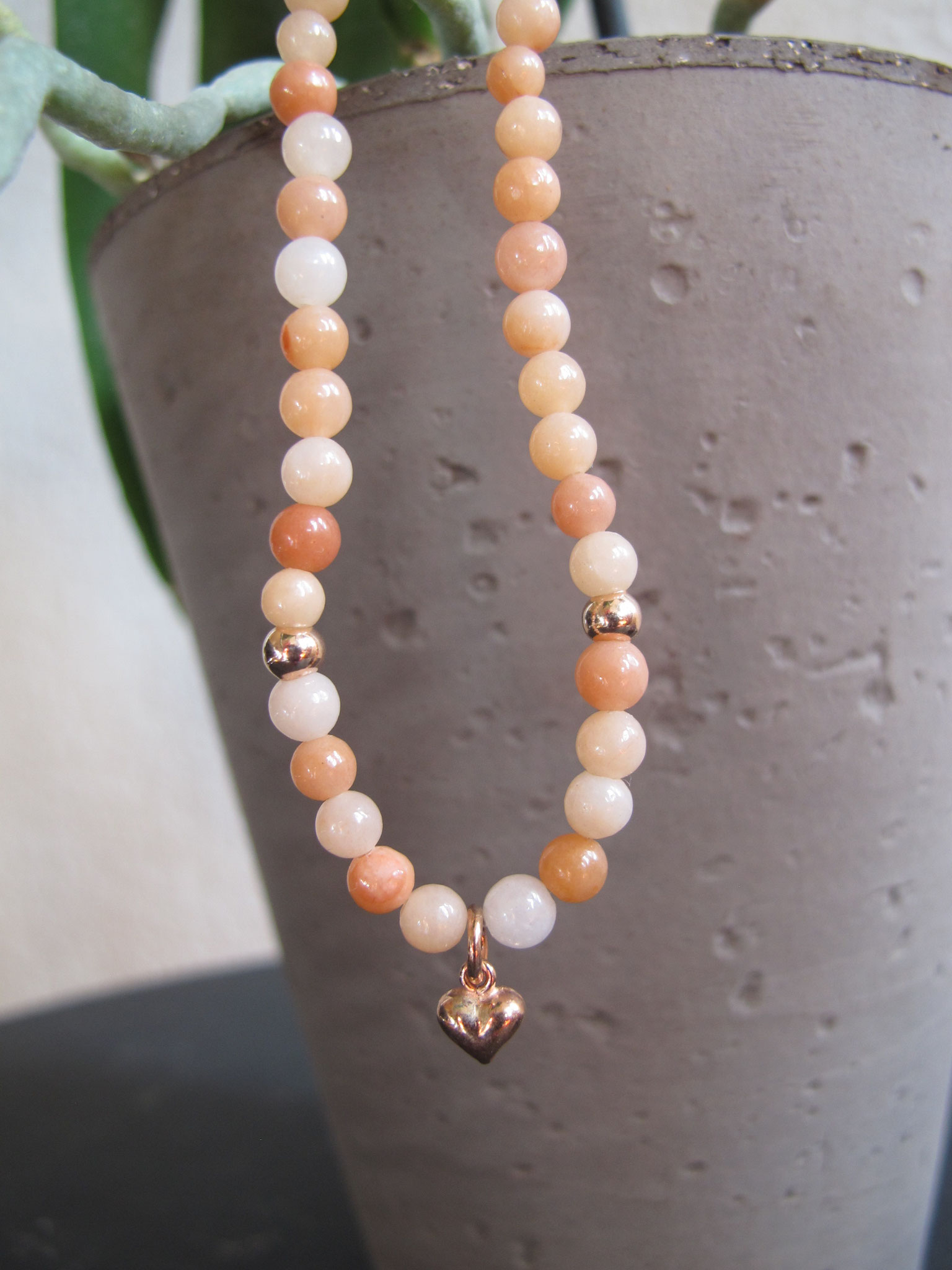 Rose coloured aventurine with a rose-gold plated heart charm