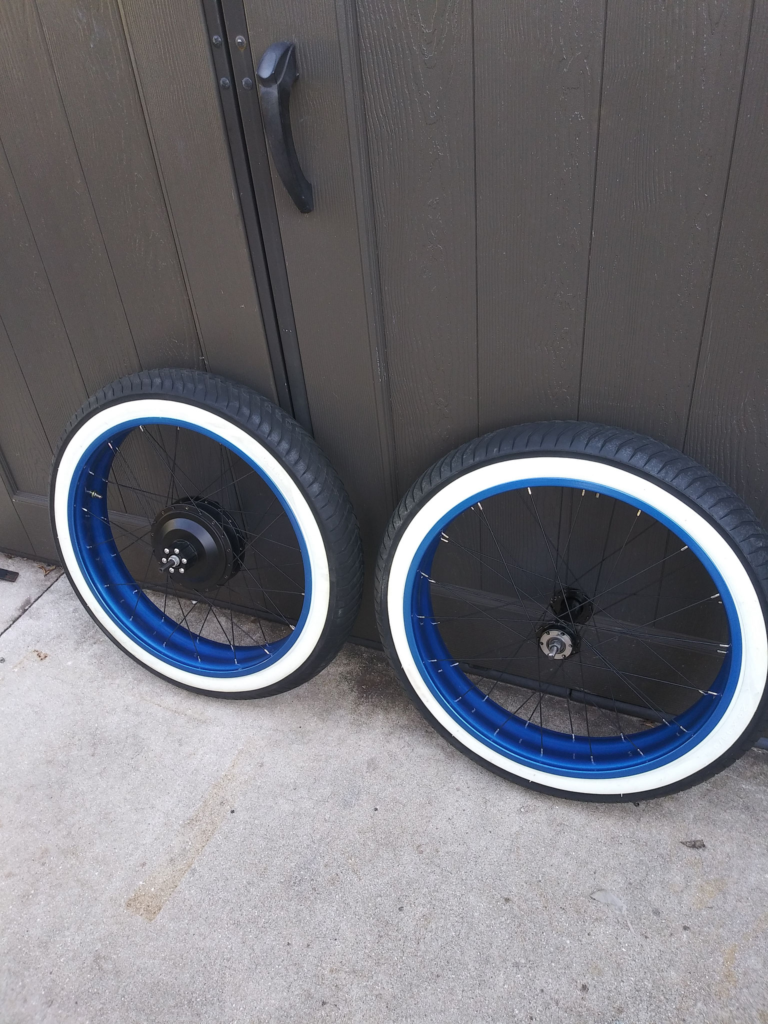 HAND BUILT 24 INCH WHEELS X 4 1/4 INCH WIDE WHITE WALLS = ALUMINUM RIMS, STAINLESS STEEL SPOKES - REAR EHUB