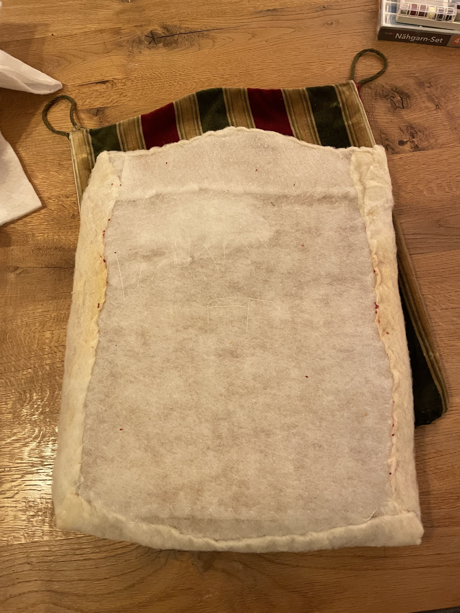 As the foam cushion is deteriorating and will continue doing so with age and use, I wrap it up in its old piece of wadding and a couple of new ones out of my stock.