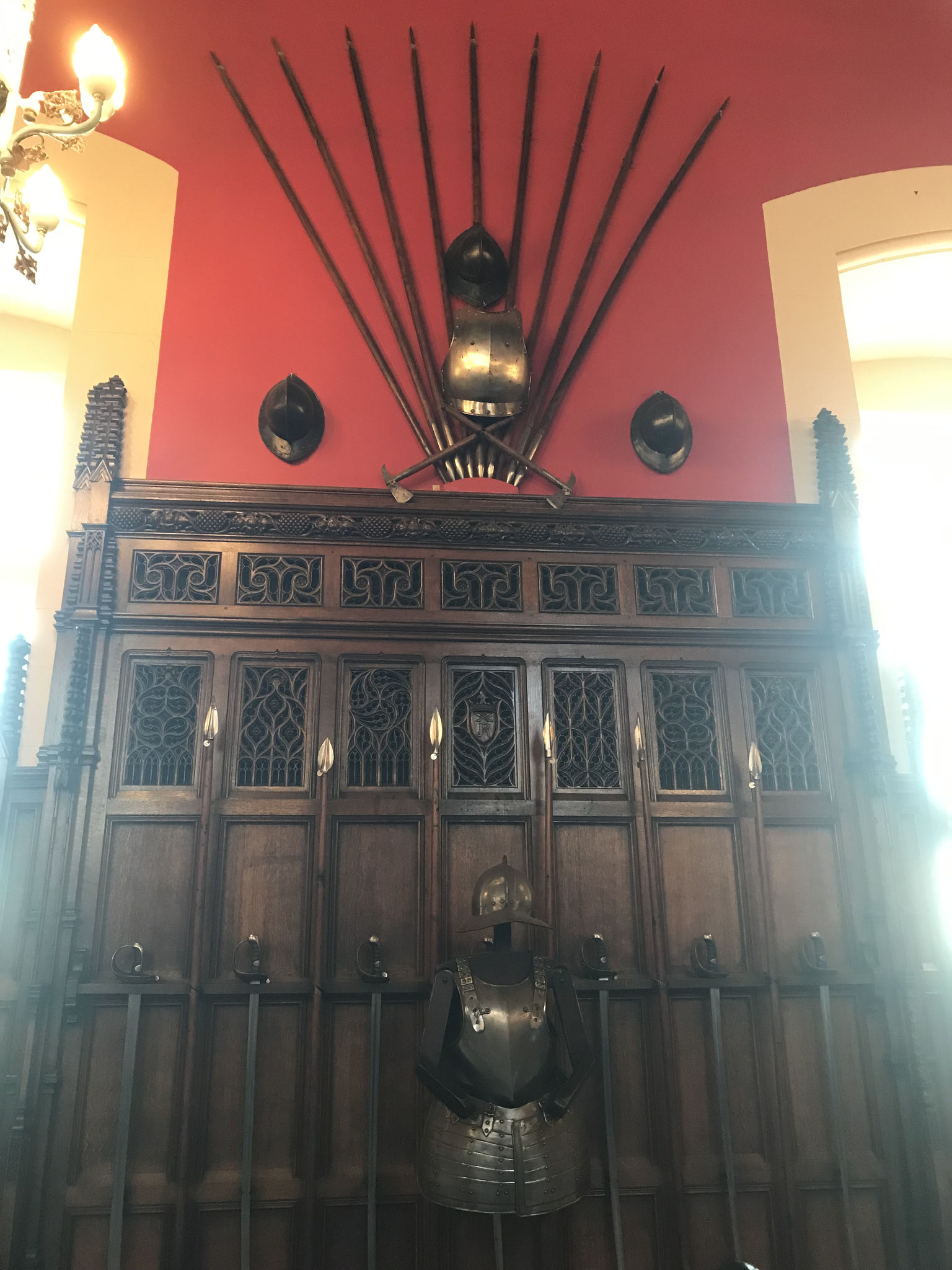 The sides of the great hall are decorated with weapons