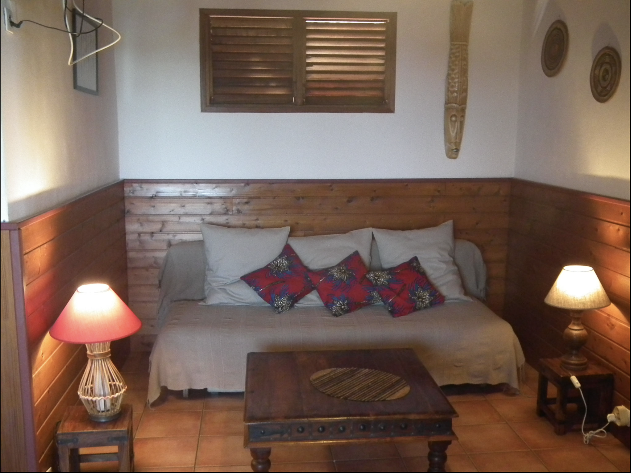 Living room, bungalow No.9 – clic-clac sofa bed, timber interior décor, light fitting