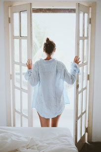 woman looking out window