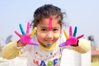 child with painted hands