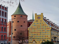 Powder Tower and facade of yellow building  in Old Riga