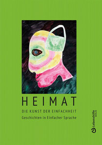 auf dem Foto zu sehen: das Cover zum Buch Heimat, es ist grün, eine Zeichnung mit einem Kopf und einer Tasche auf Höhe der Ohren, unten drunter Titel: Heimat, die Kunst der Einfachheit, Geschichten in einfacher Sprache