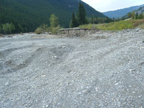 This is the road that washed away. The new highway is to the right higher up the river bank.