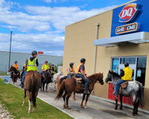 High Schoolers on horseback at Dairy Queen