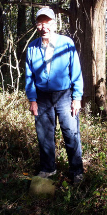 Alvin Curtis with one of only three foot stones (B.V.) still remaining in the Vawter Cemetery.