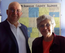 Bob Fischer, left, president of Assets Protection, Inc., presents a check for $250 to Gordana Rezab, president of the McDonough County Historical Society to support the cemetery sign project.